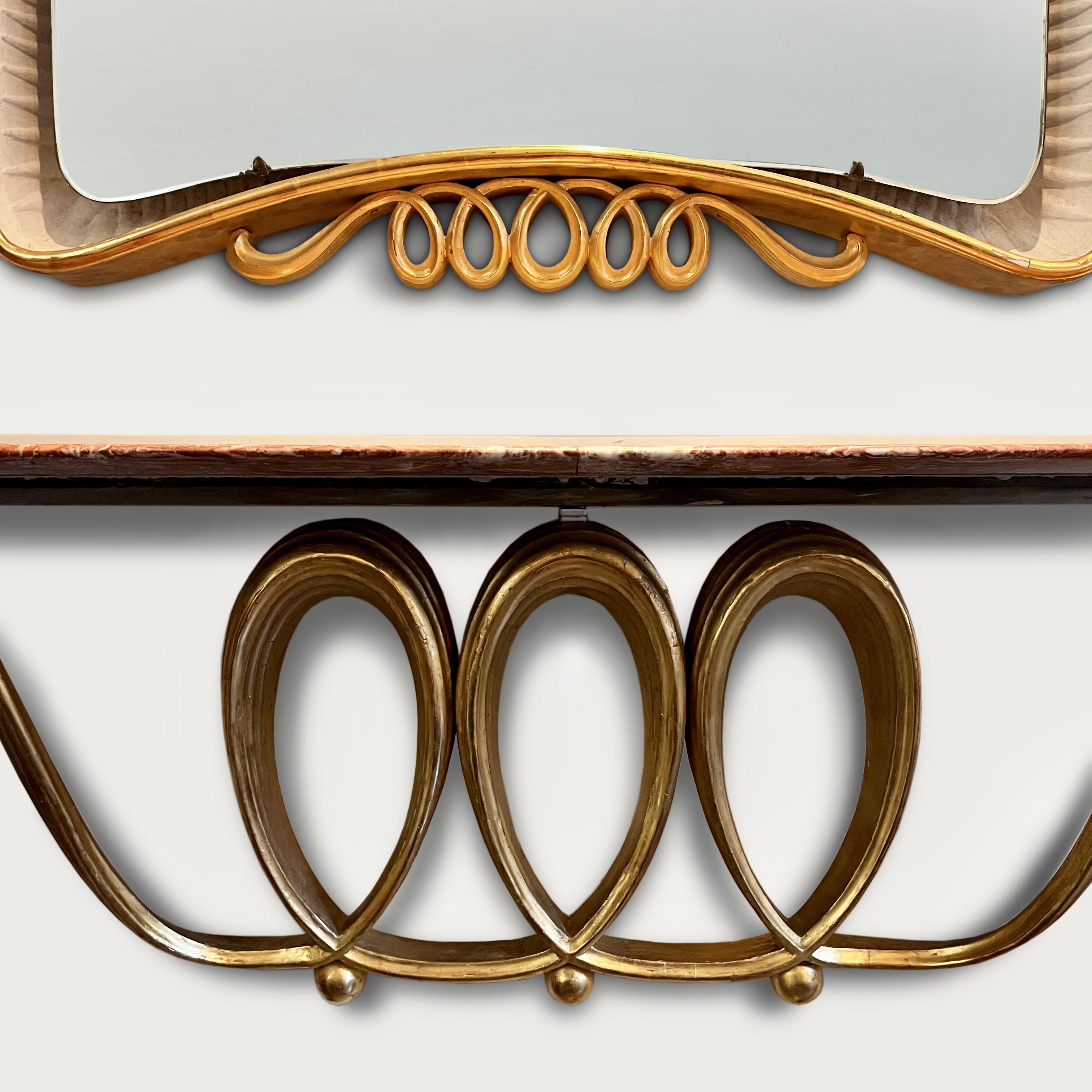 A rare floating console and mirror (No6652) by Osvaldo Borsani designed for Casa Ramella Levis 1946 . Executed in gilded wood, marble and mirror  a seamless hand carved looped coil appears to hold a floating marble top, the looped form is cleverly 