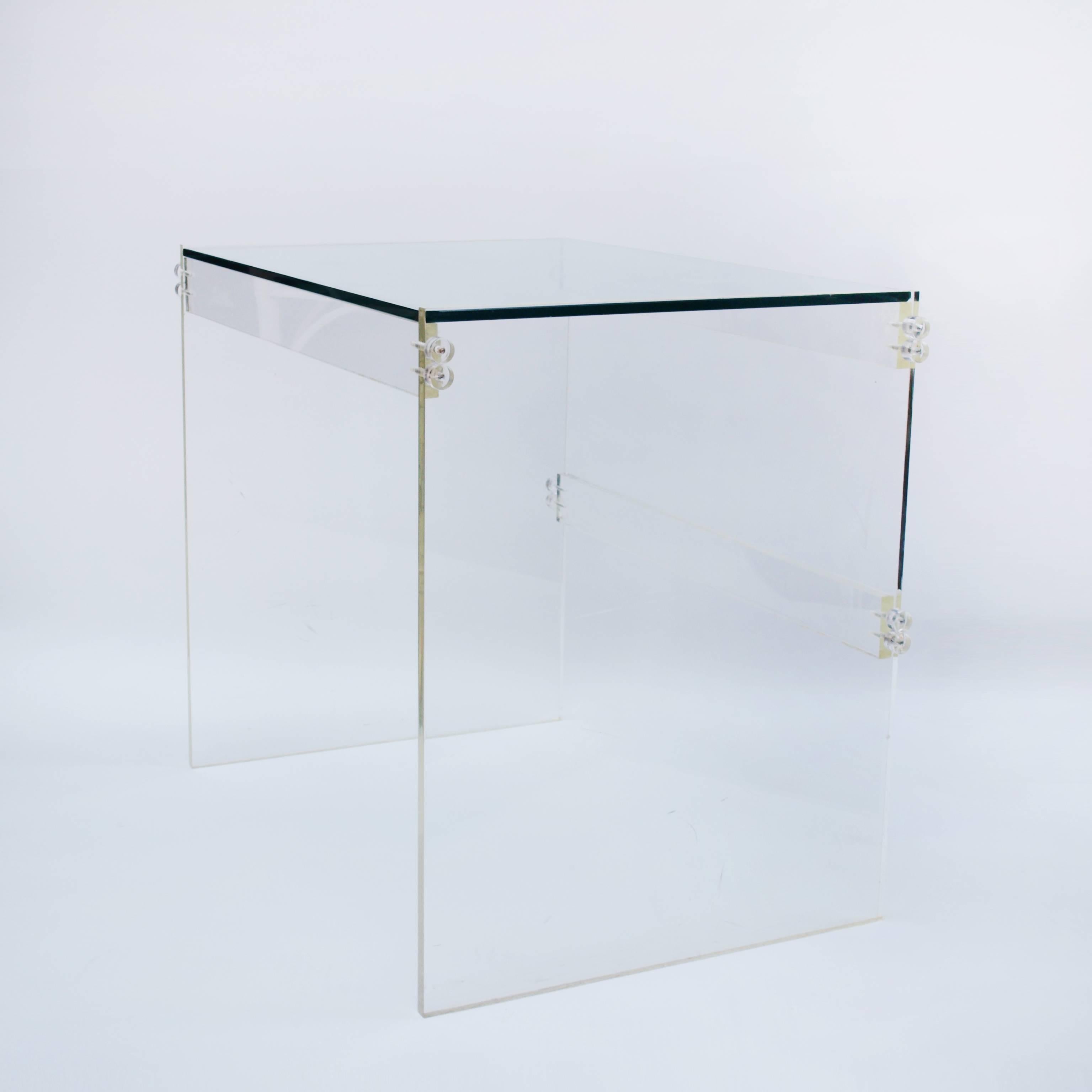 A beautiful and clean design, this table is executed in Lucite with a glass top. The Lucite sides are 0.75 inches thick and the glass top is 0.5 inches thick, circa 1980s.

 