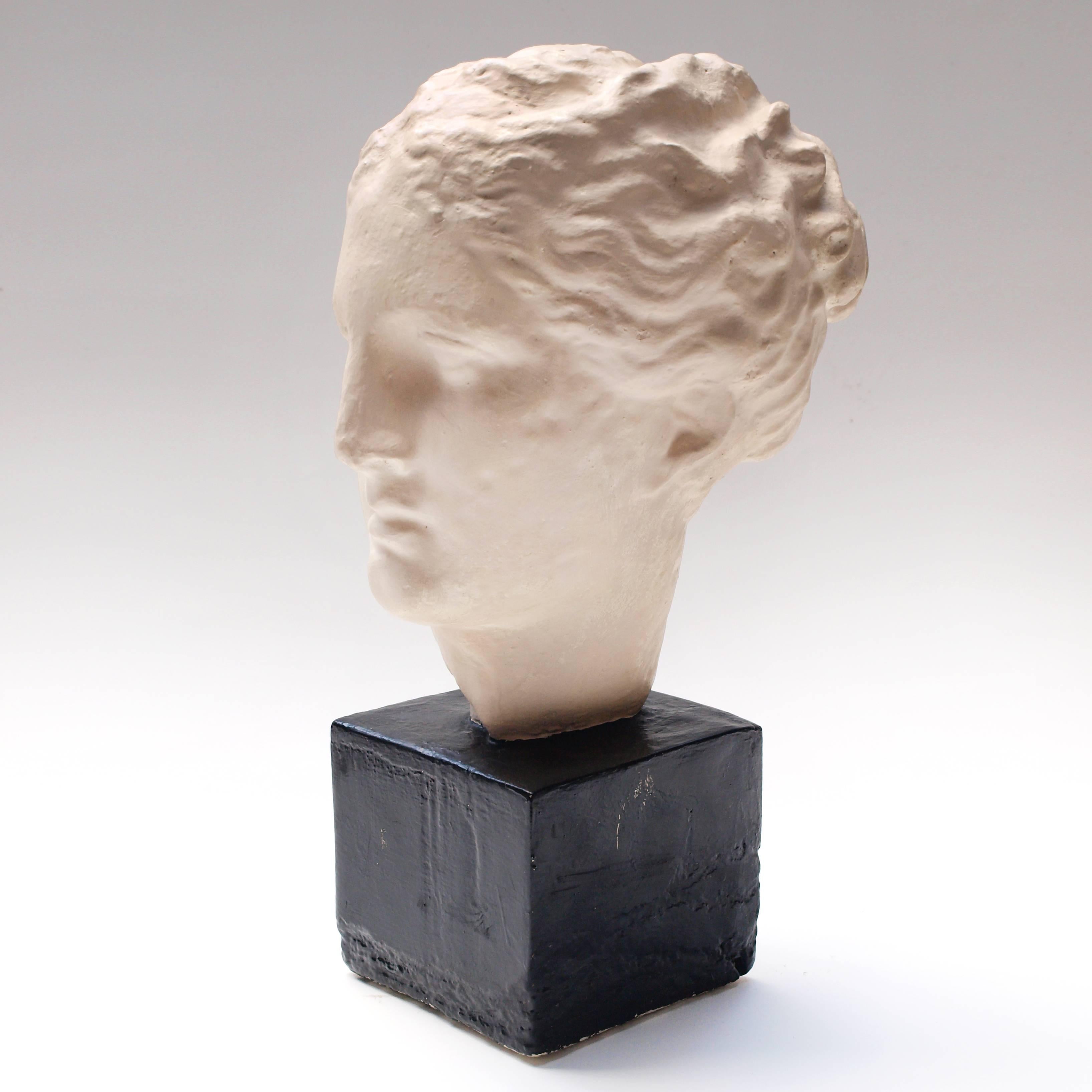 A highly decorative reproduction cast bust of a Roman Empress in sideways pose.