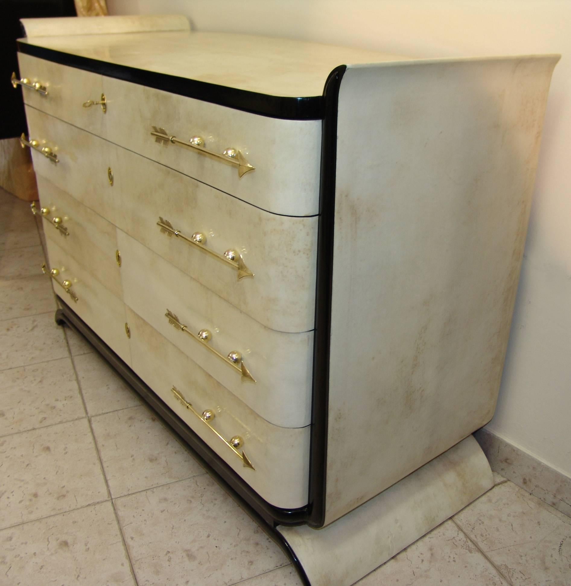 Exclusive 1930s dresser made of parchment with ebonized details, the handles are in a brass fusion.