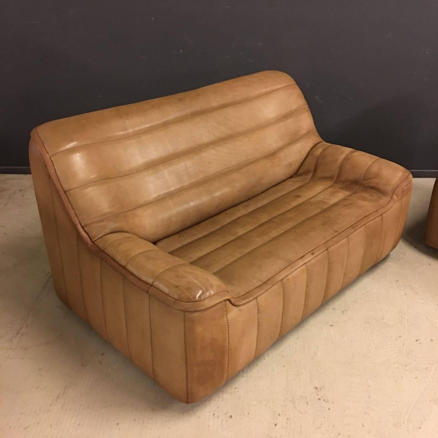 Beautiful set of two, DS84 two-seat sofas by De Sede. Made in thick, cognac collared, Buffalo leather with e a nice patina. Manufactured in Switzerland during the 1970s. Both remain in very good condition. Price for the set.