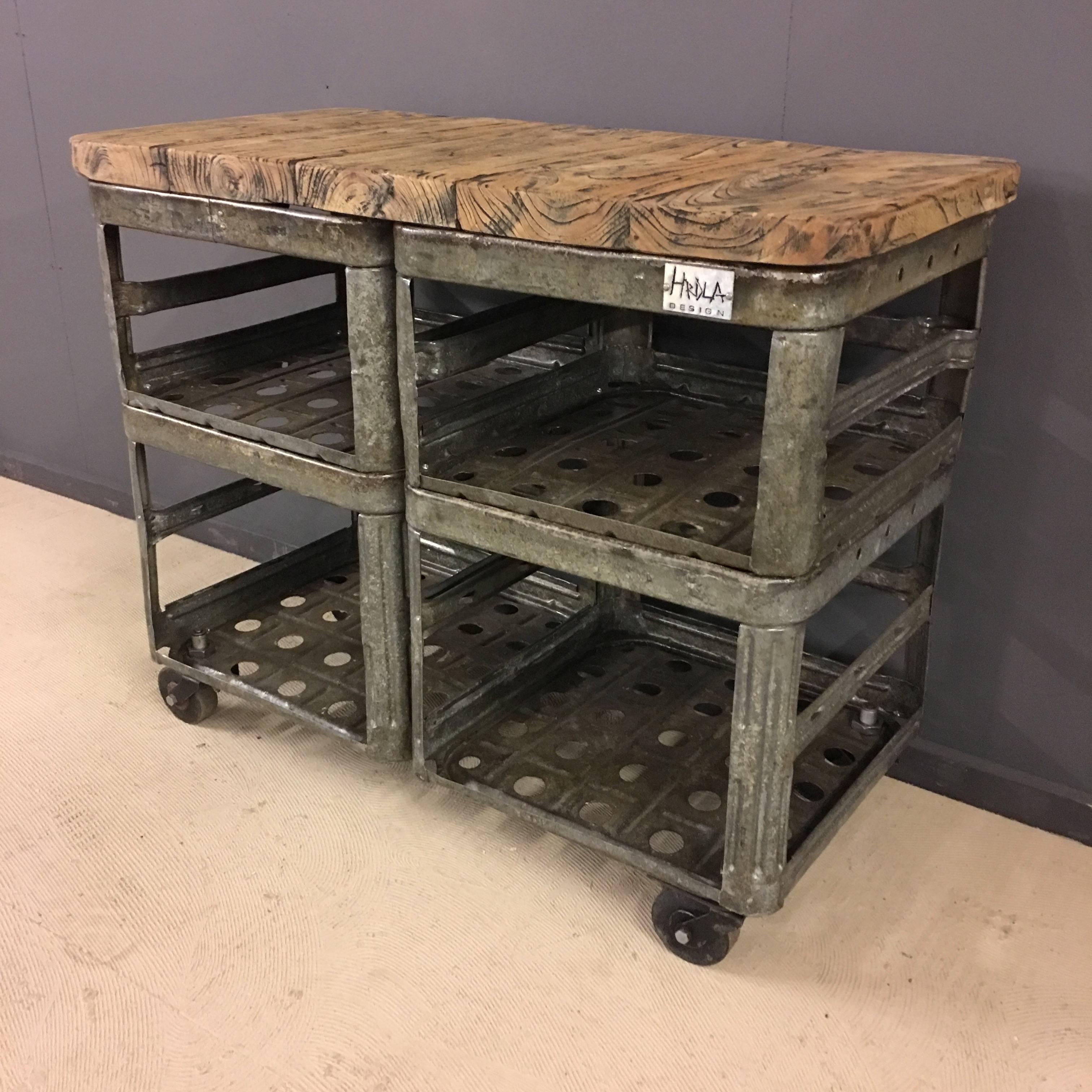Cool Industrial rack by Hrdla Design.
Made in Czech Republic of vintage galvanized crates.
Gorgeous wooden top and four small Industrial wheels.