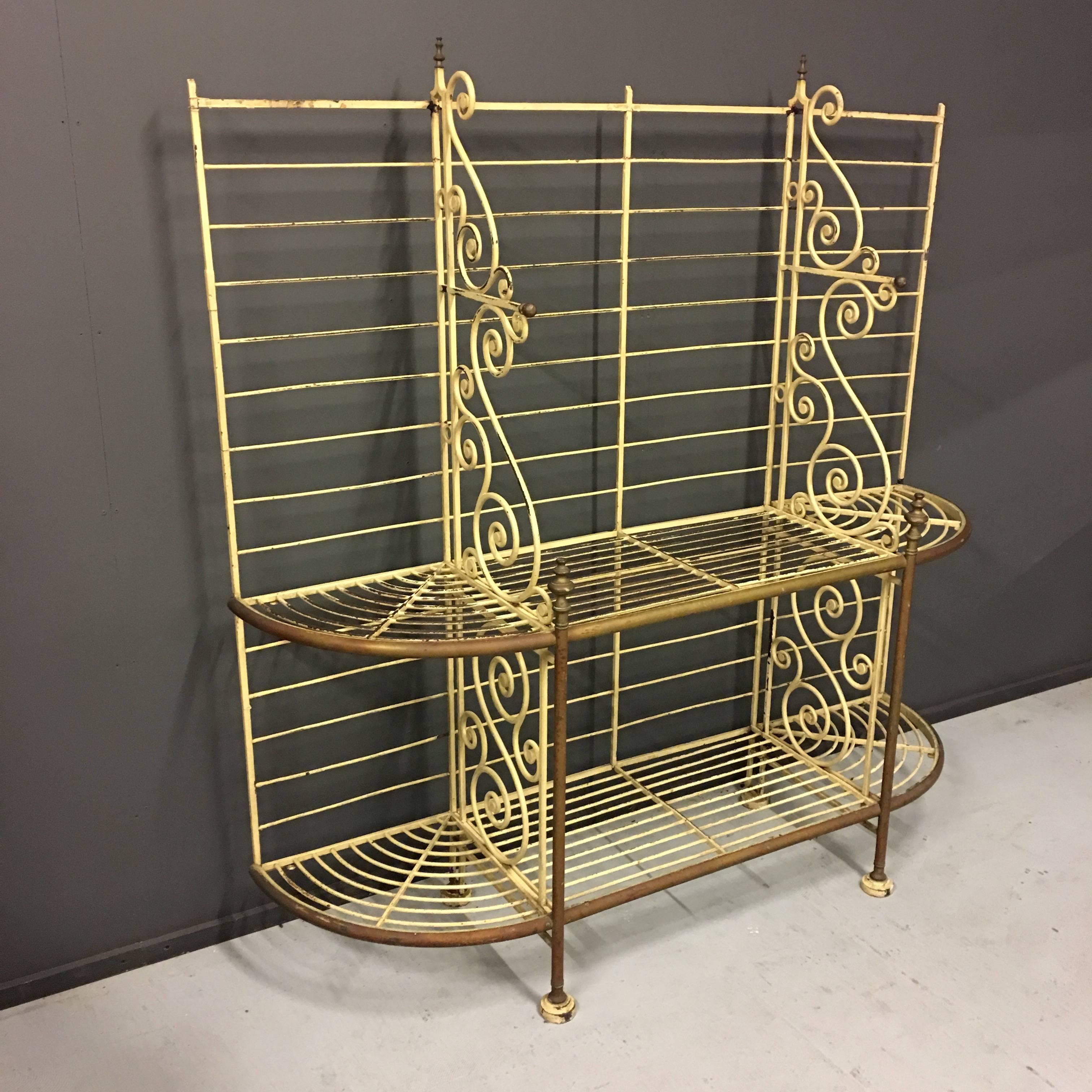 Antique bakers rack. Manufactured in France during the 1920s. Made of metal with brass details.