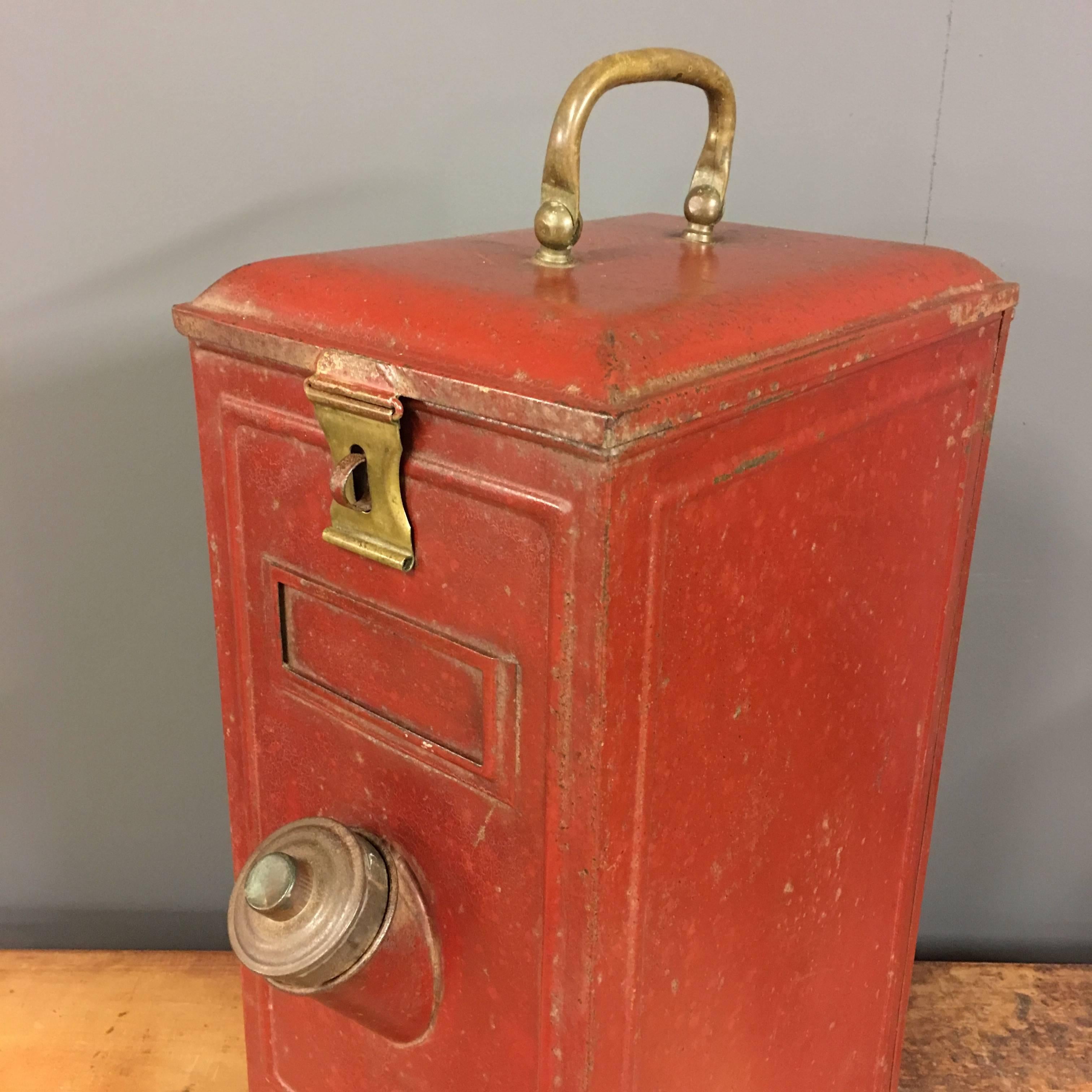 Antique red tin Coffee been dispenser. Made in German during the 1930s. Brass detail and original paint. This item is in good condition.
