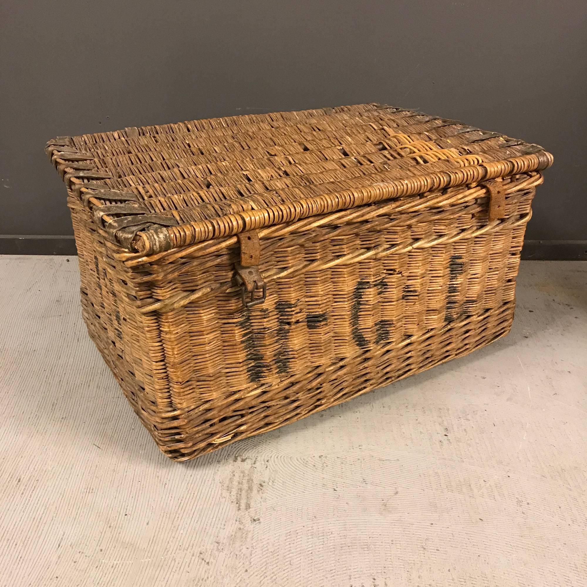 Wicker basket with leather straps made in England during the early 20th century.