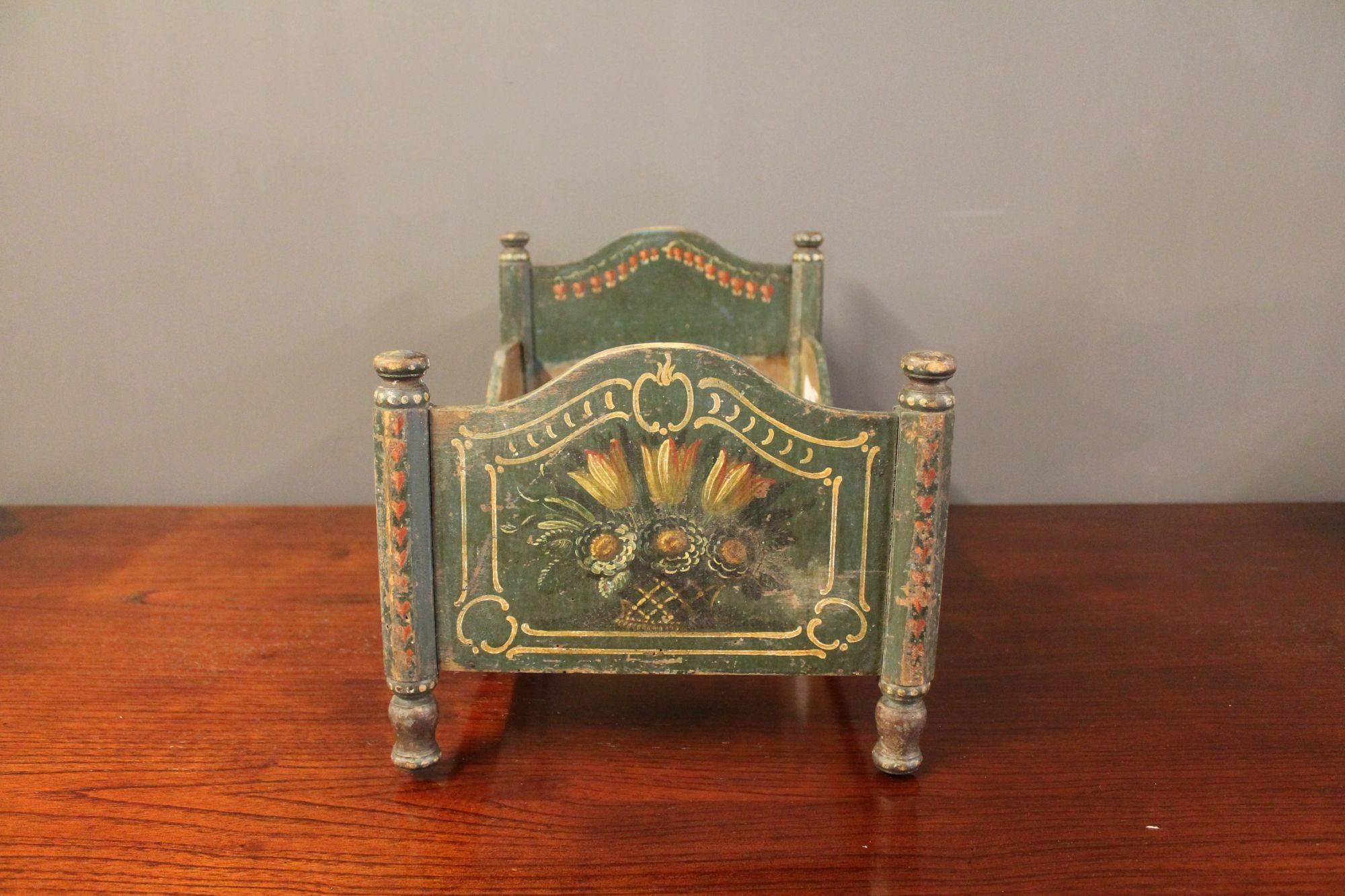 Miniature bed decorated with handpaintings. Made circa 1860s in Germany.
    