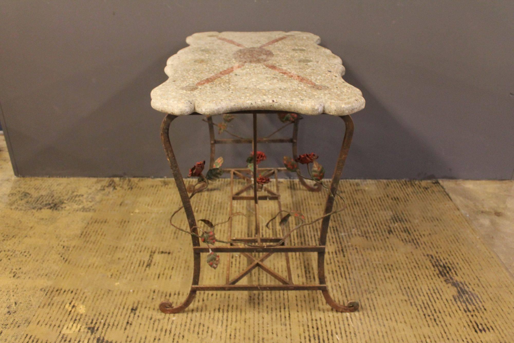 Art Deco table with terrazzo tabletop and wrought iron frame, decorated with detailed handmade roses. Made in France in the early 20th century.
 
