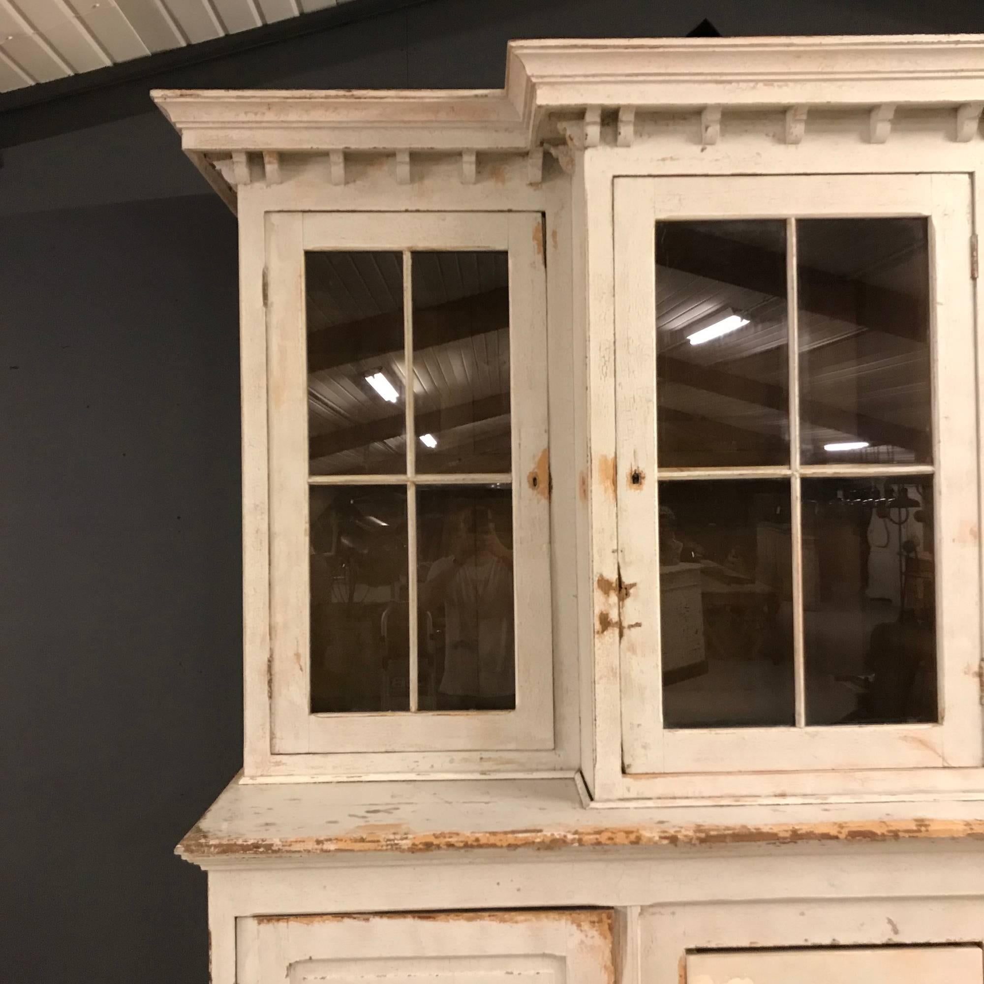 Big and unusual buffet cabinet with multiple layers of original paint. Was used in School in France. Bottom part has two doors in the front and two doors on both sides. This cabinet was made in France approx. 120 years ago. It is restored where