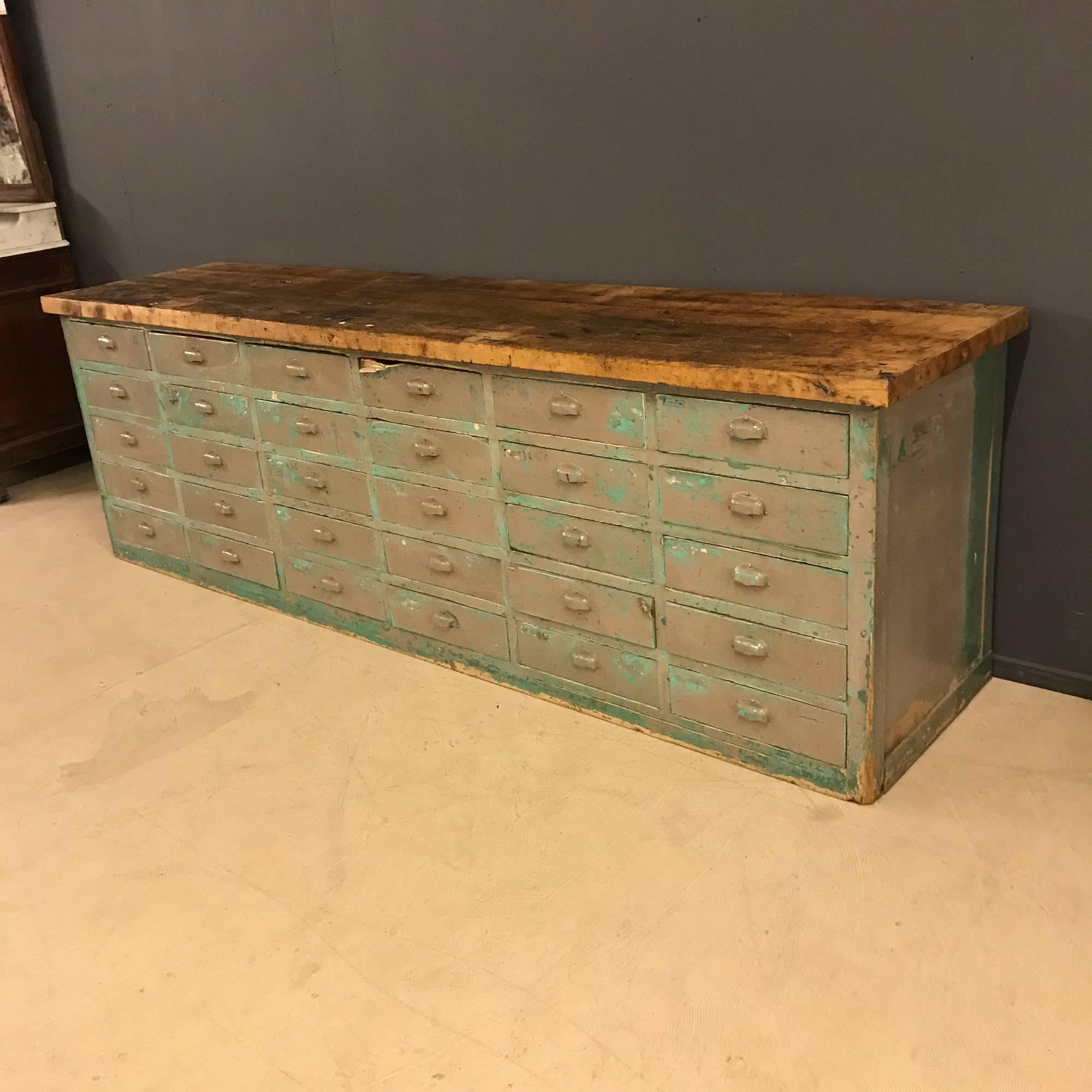 Big bank of drawers with nice original handles and oak wooden top. Has 30 drawers and nice patina. Was used in a factory workshop for storage. With signs of use it remains in good fair condition.
