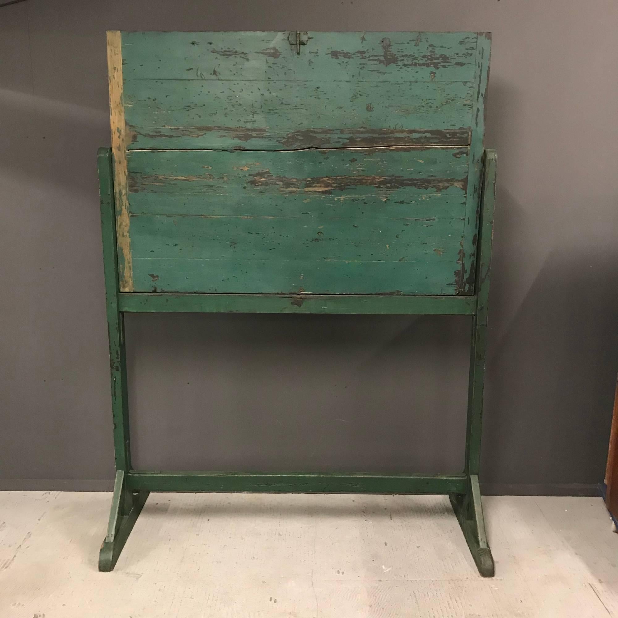 French antique green wooden black board. Nice patina, distressed paint and in good condition. The board is rotatable.
