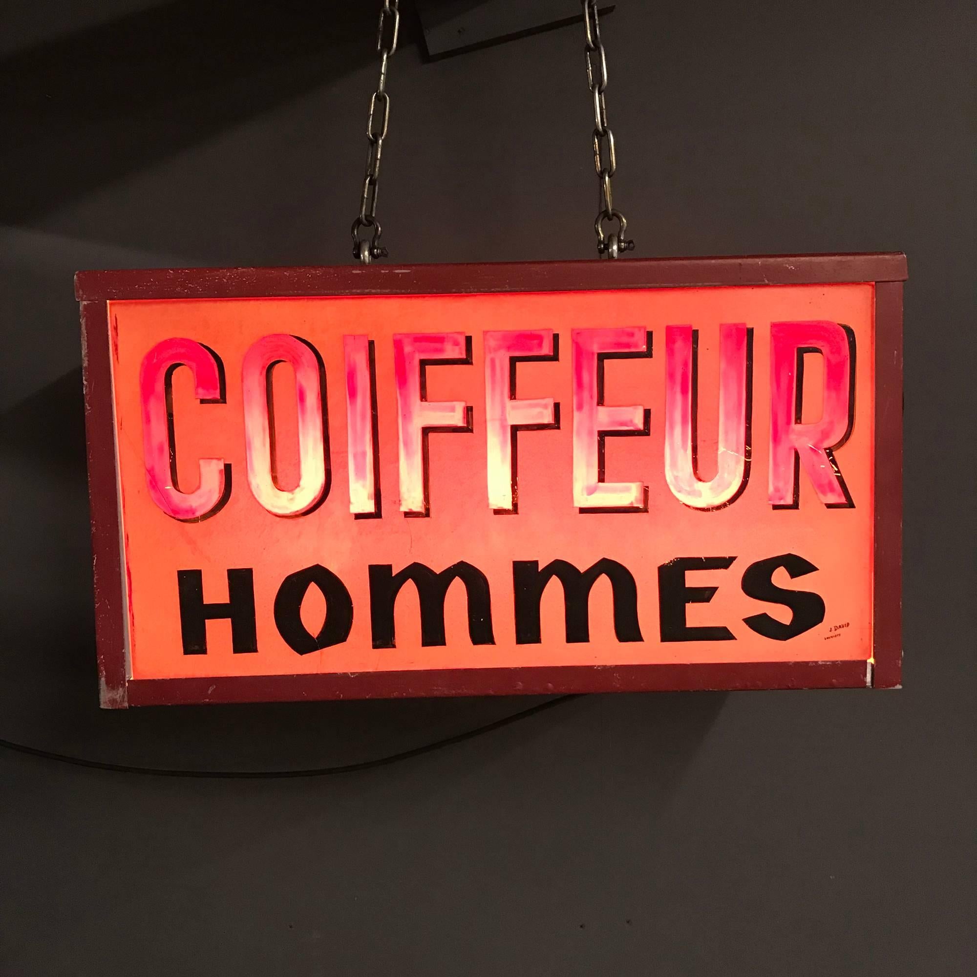 Vintage double sided barbershop sign from France. “Coiffeur Homme” Made by J. David, in Louviers France during the early 20th century. The aluminium frame has been restored and the lighting is converted to E27 with three porcelain sockets and an EU