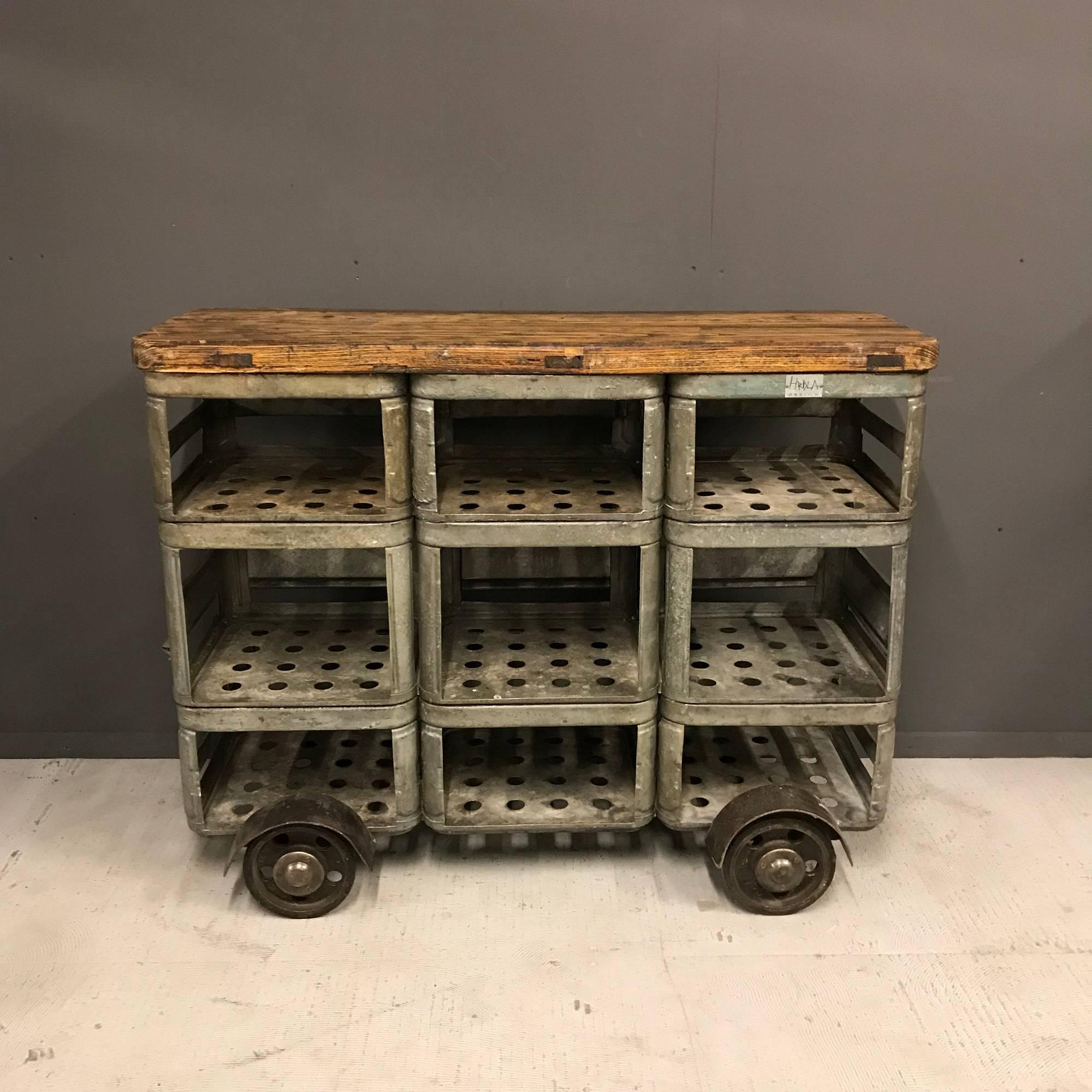 Industrial shelving unit by Hrdla Design. Made of old zinc crates used in the 1960s for soda and milk bottles.