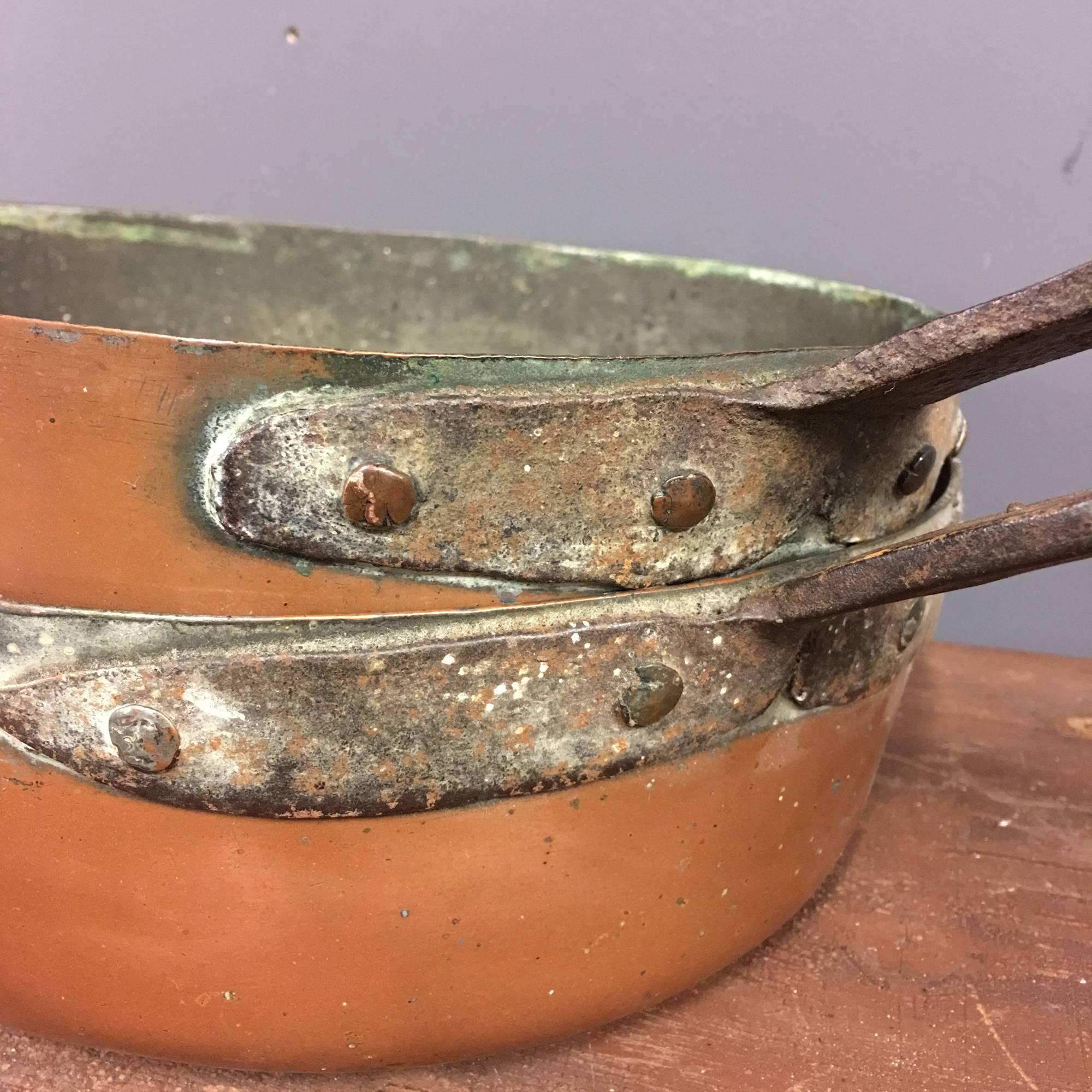 Vintage copper kitchen pans. This set of two and remains in very good condition.