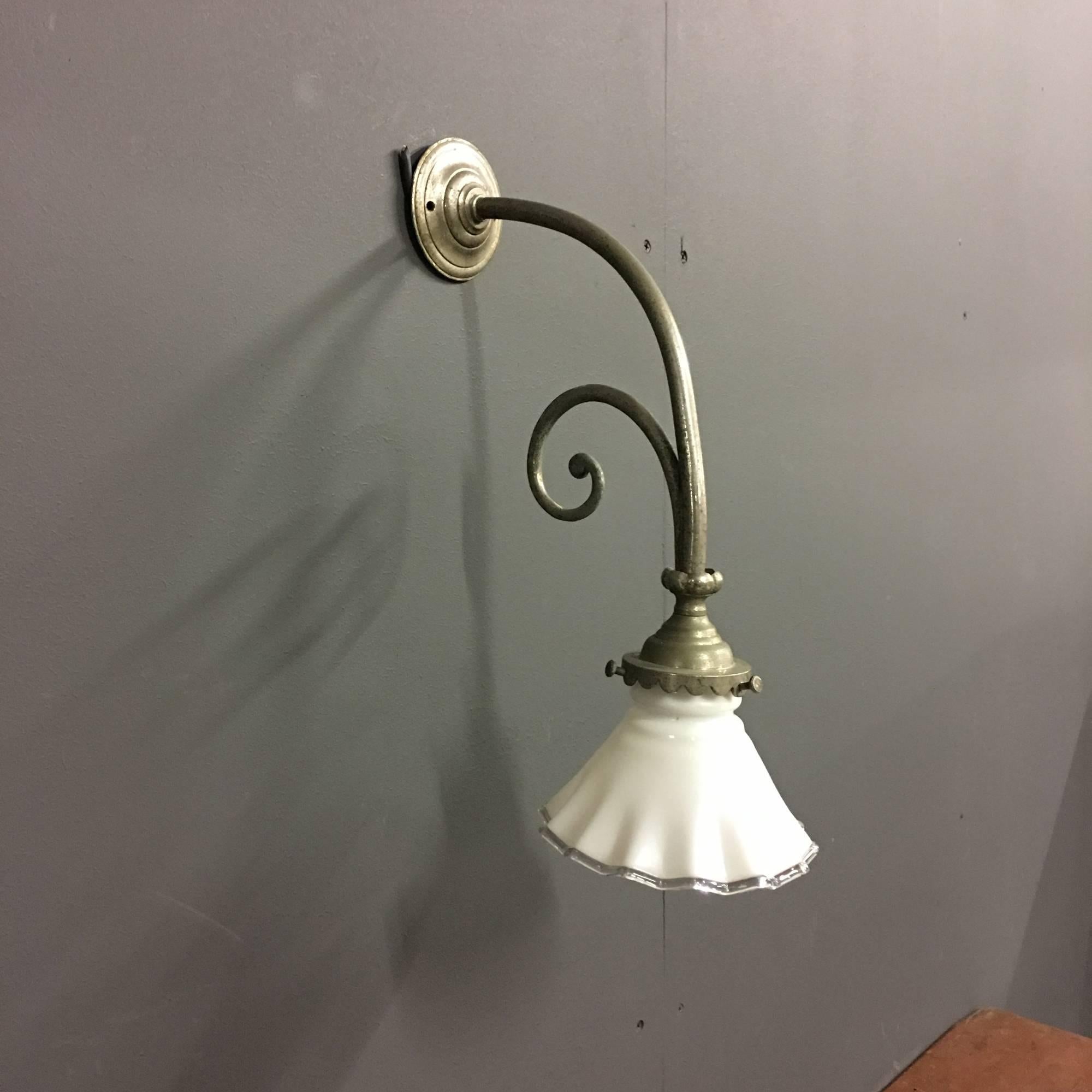 Small wall light fixture with white opaline glass lamp shade. Has the original Bajonet socket but has been rewired and is ready to use. With nice wear and patina on the chrome, This light remains in good condition.
