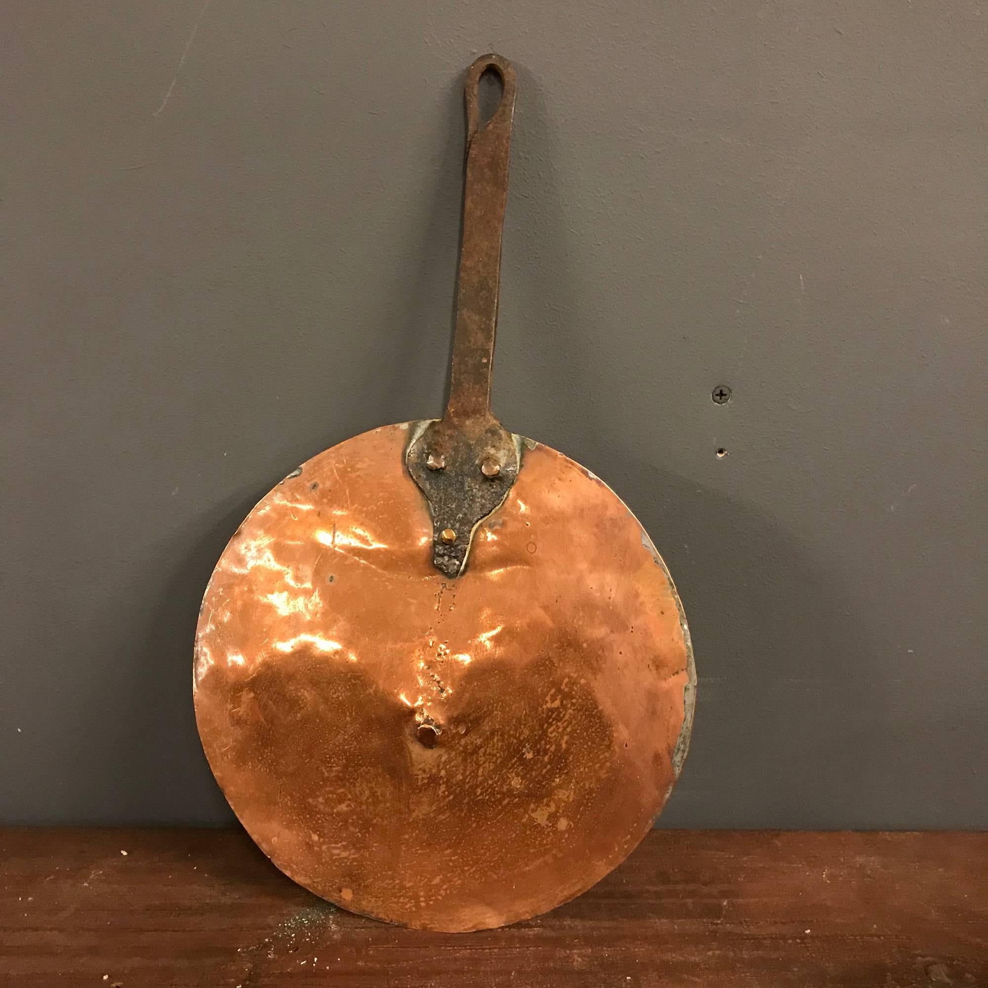 Antique copper pan with original lid. Remains in good condition.