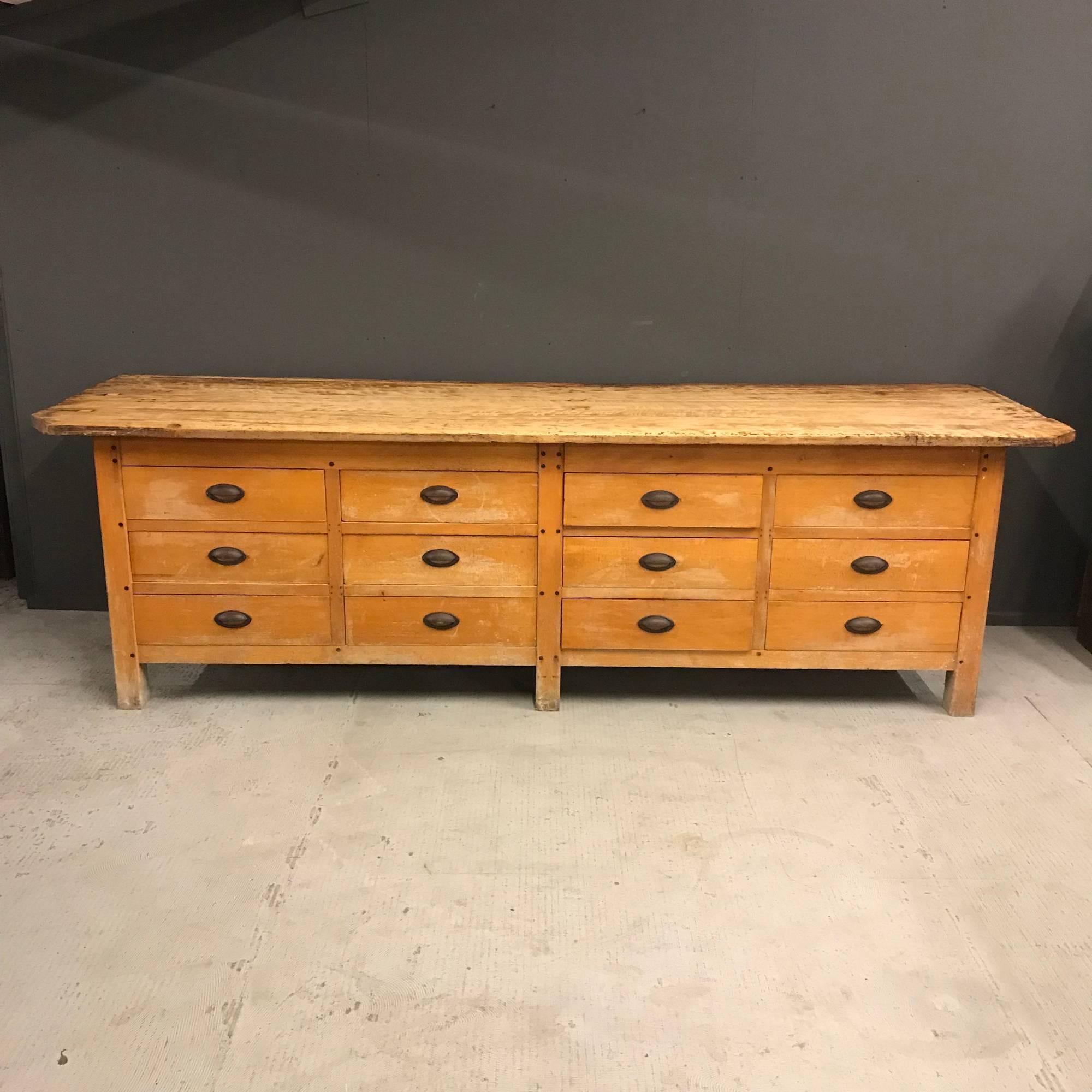 Big yellow bank of drawer workbench from a Belgium Bakery. Was made in Belgium during the early 19th century. Nice cast iron handles and 12 drawers. Has been restored and waxed and remains in good condition.
Belgium, early 20th century
Size of