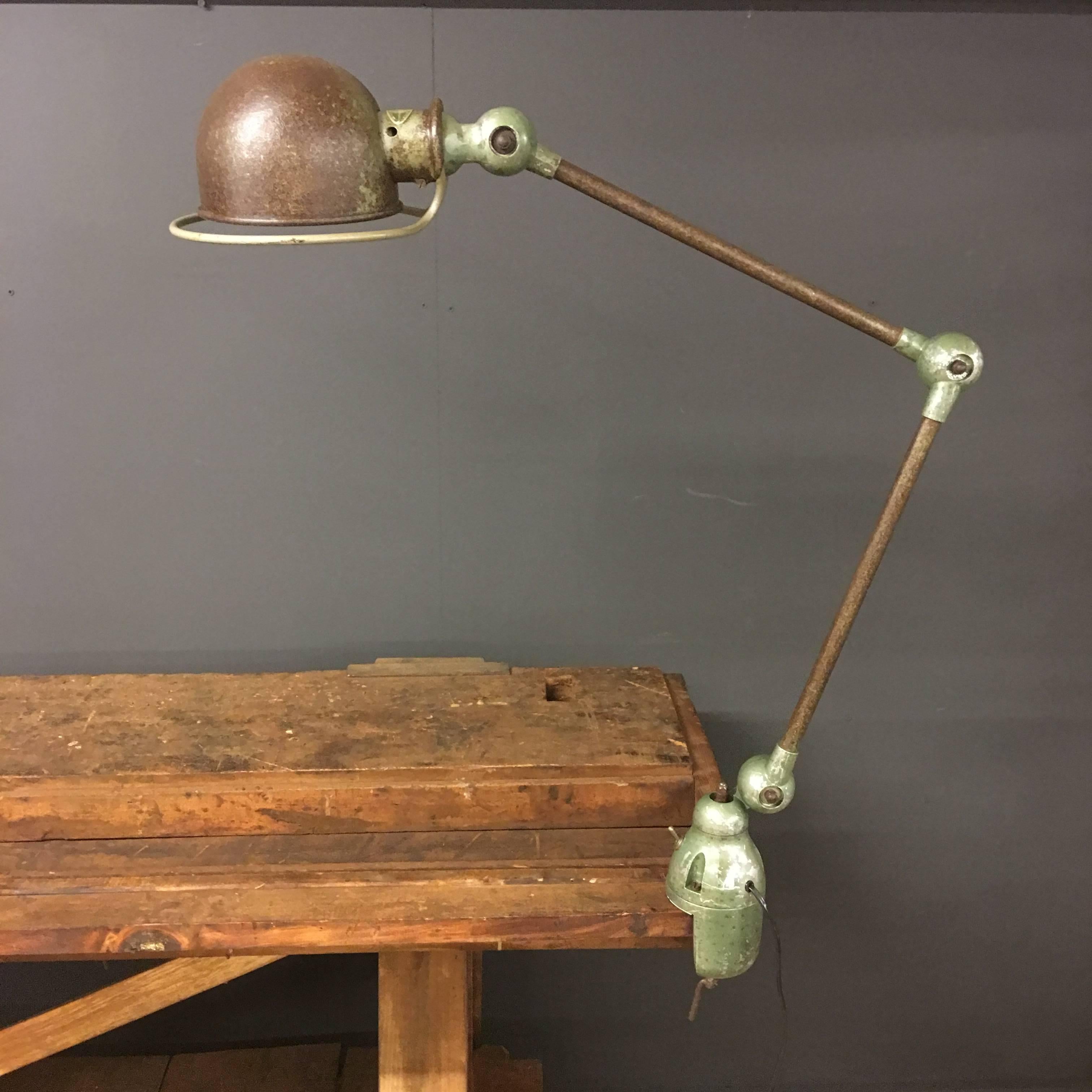 This French Industrial workbench light was designed by Jean-Louis Domecq and manufactured by Jieldé in Lyon, France, during the 1950s.