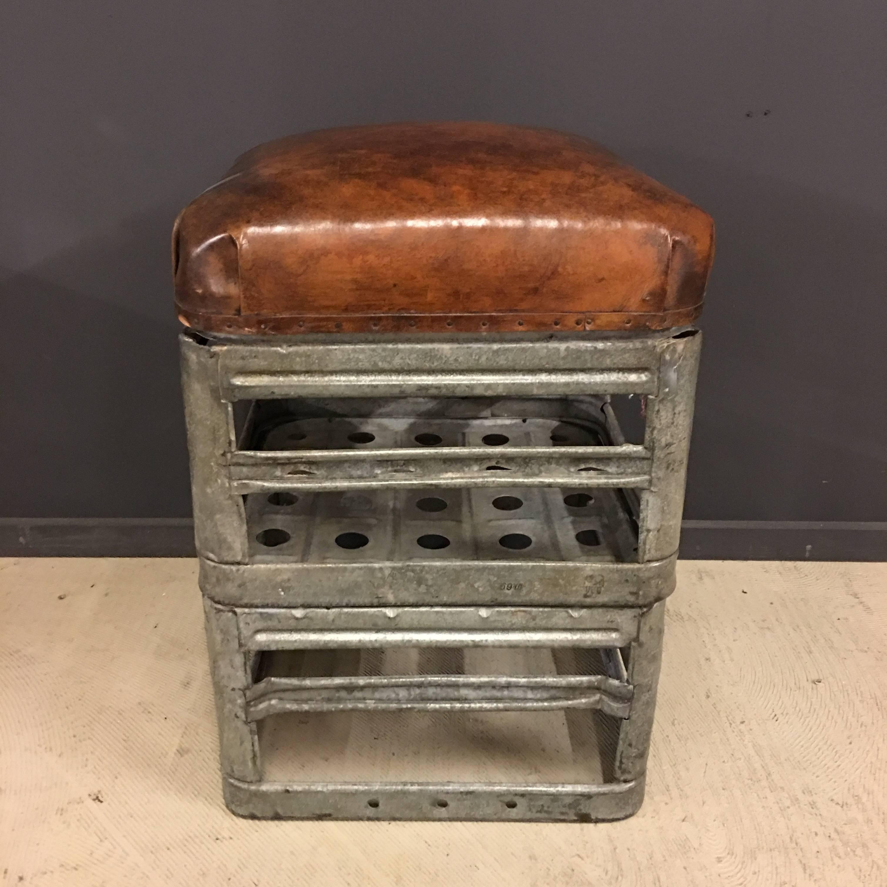 This Industrial stool is manufactured by HRDLA Design. Made of vintage zinc soda crates used during the 1950s and old leather of gymnastic furniture.

More of these stools can be made.
Please contact us for bigger quantities
