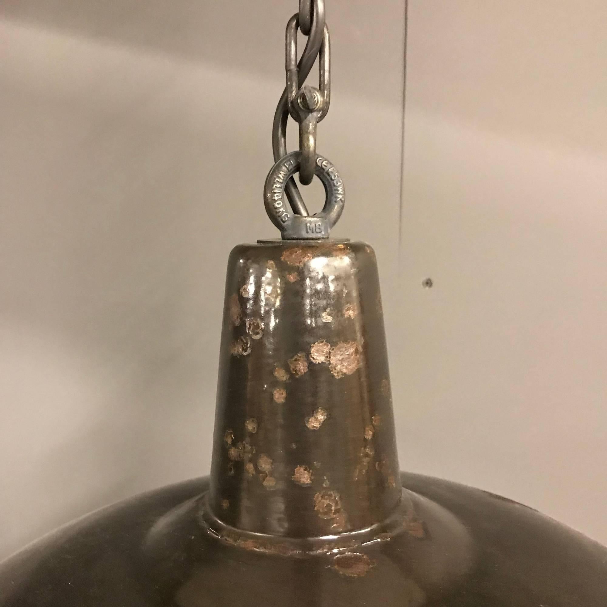 Black enamel factory pendant light. Have been restored and converted to E27 with an porcelain socket. Comes with an 100cm long patinated chain.
Size of this one-piece shiny black enamel factory pendant light
Measures: 42 x 42 x 24 cm, 100cm