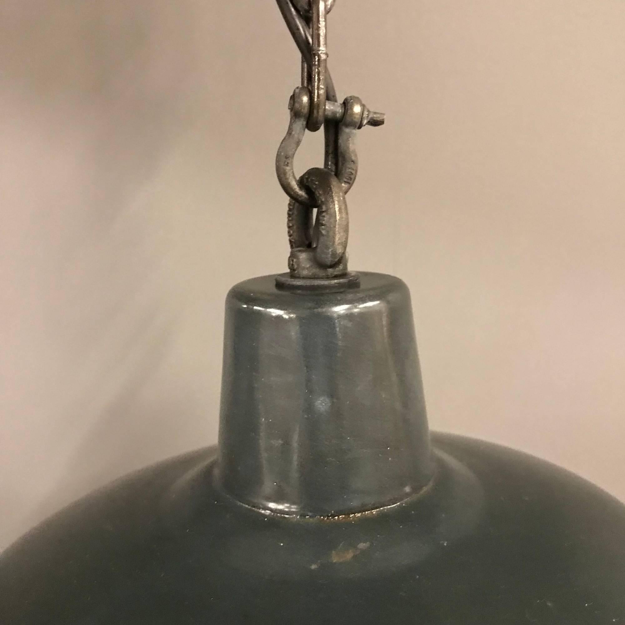 Black enamel factory pendant light. Have been restored and converted to E27 with an porcelain socket. Comes with an 100cm long patinated chain. Shade is slightly bent.
Size of this one-piece small black enamel factory pendant light
Measures: 32 x