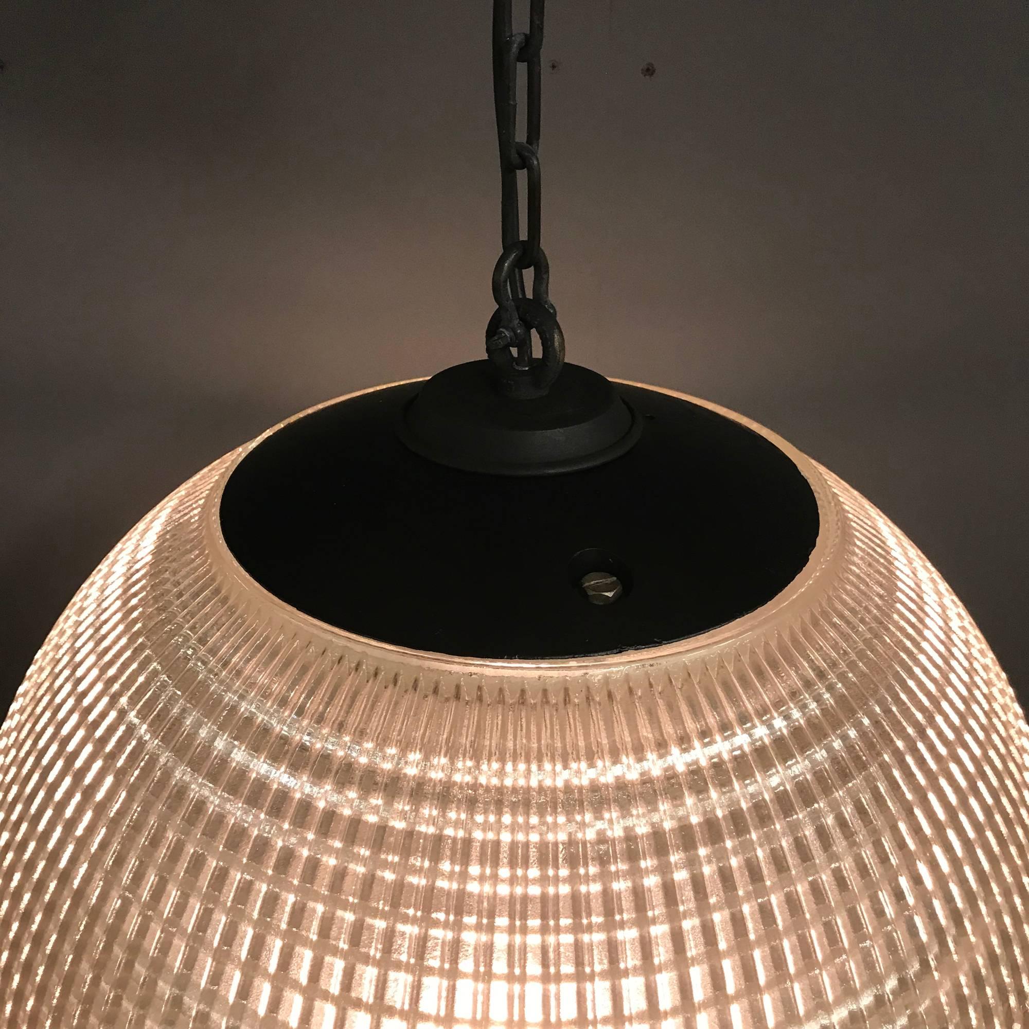 This light is an original Holophane street light from Paris, France. Manufactured during the 1970s. The hallmark of Holophane luminaires, or lighting fixtures, is the borosilicate glass reflector/refractor. The glass prismsribs provide a combination