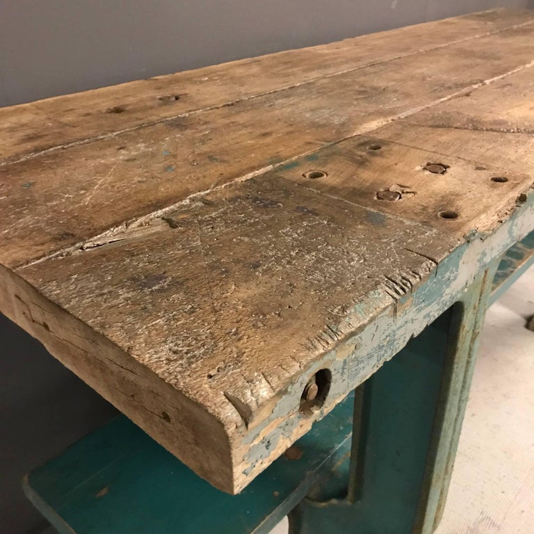 Heavy Industrial workbench on cast iron base. Has been cleaned, waxed and polish and remains in good condition.
France, early 20th century
Size of this Industrial workbench with blue cast iron base
191 x 64 x 83 cm.