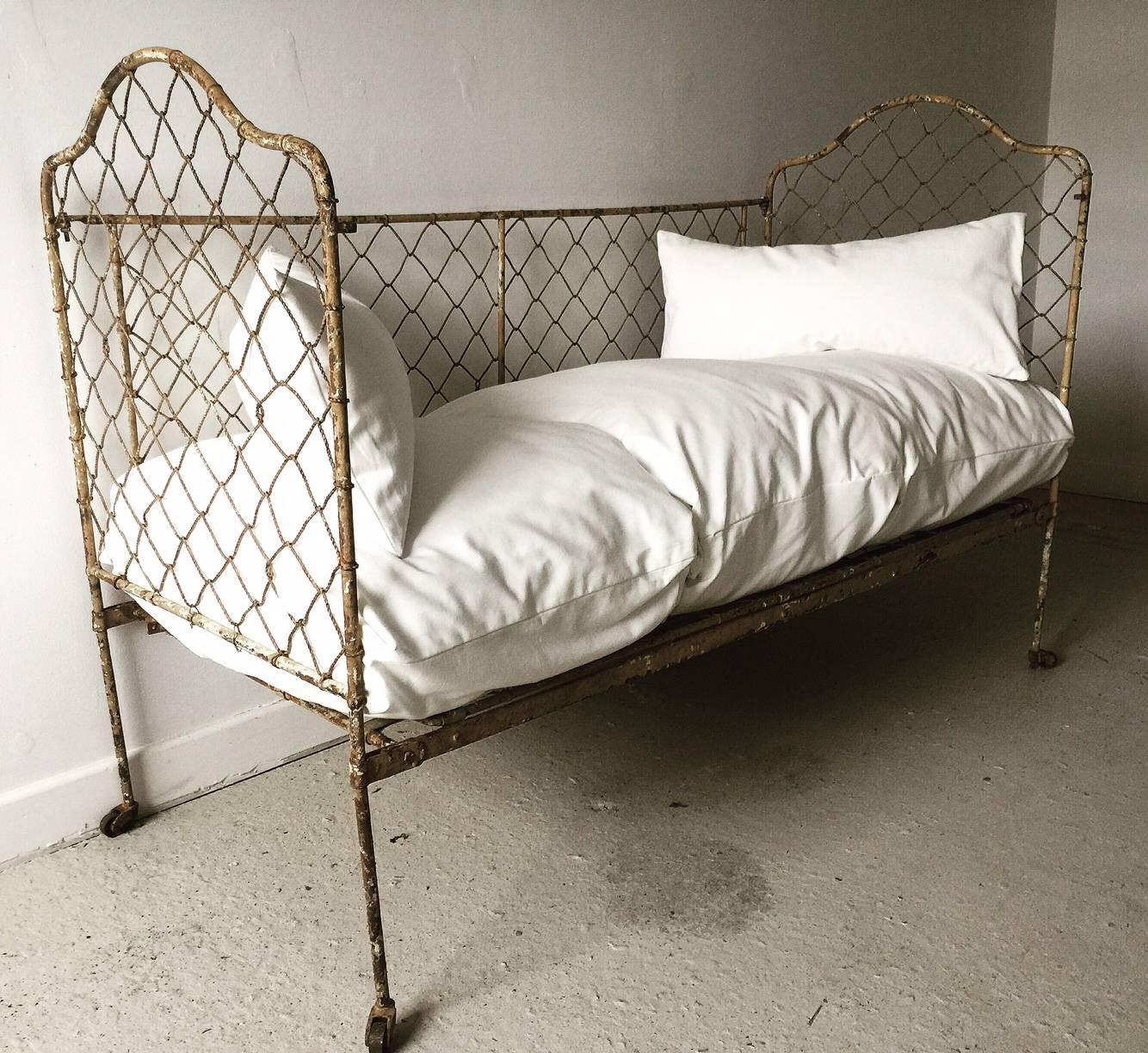 Antique 19th century French wrought iron daybed with original paint.
please not this does NOT include the cushions 