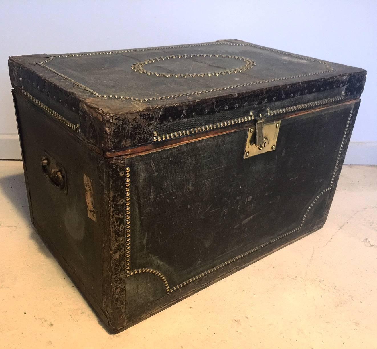 Antique Henry Pound and Sons canvas and brass studded steamer trunk traveling chest ideal for a side or coffee table or just for storage.