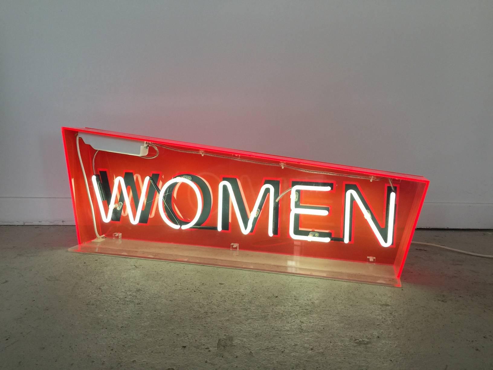 Vintage neon ladies restroom sign in a Perspex box and mounted on a Perspex stand. Please note this item may need converting to your countries specific standards.