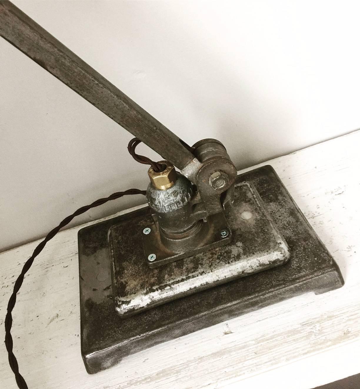 Vintage industrial EDL bandit machinists angle poise lamp with a fantastic aged patina, please note this item may need to be converted to your countries standards and specifications.