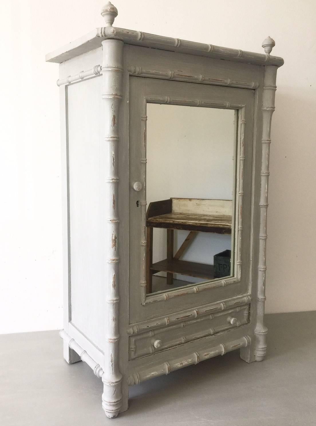 Vintage antique French carved pine faux bamboo mirrored washroom bathroom cabinet with a later shabby chic paint finish.