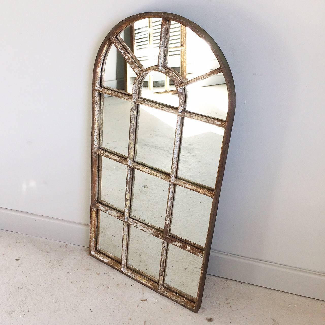 Antique Victorian arched top cast iron window frame converted to a mirror from a Yorkshire railway cottage.