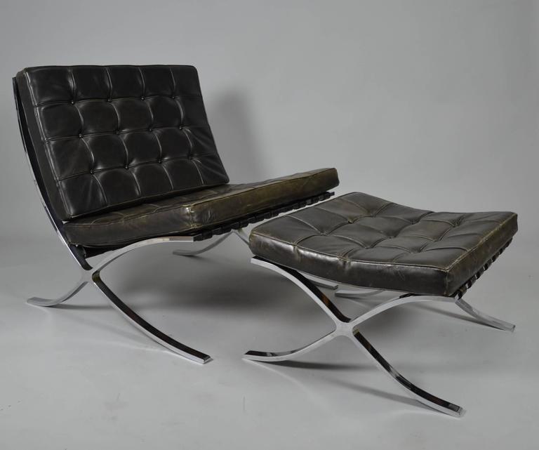 Designed by Ludwig Mies van der Rohe in 1929, produced by Knoll International in the 60th. This Barcelona with Ottoman was bought in 1968 by the former owner. Stainless steel, leather straps and leather cushions.