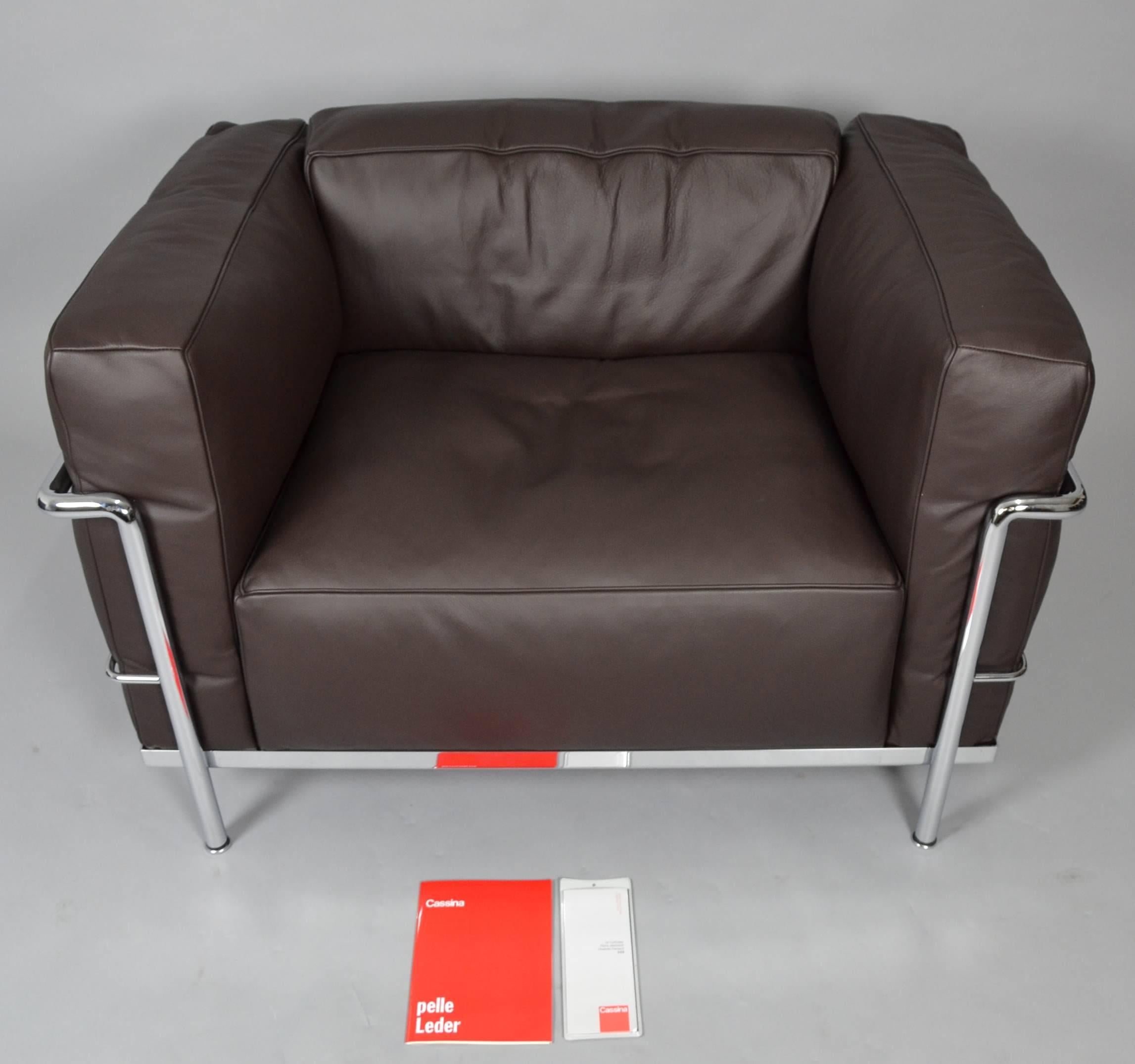 Designed by Le Corbusier, Pierre Jeanneret and Charlotte Perriand in 1928. Produced and signed by Cassina. Stainless steel with down cushions in black leather.