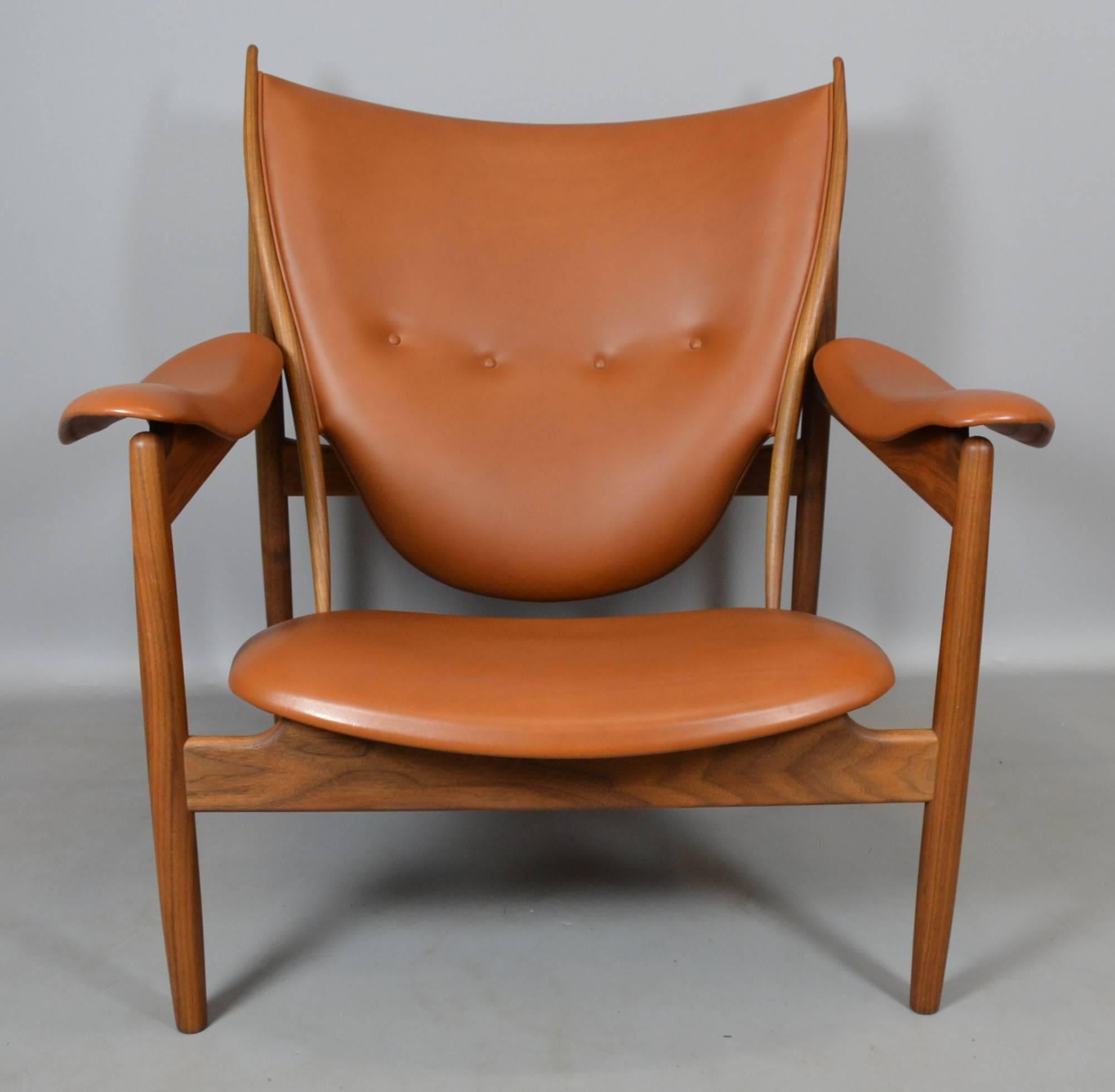Designed by Finn Juhl in 1949, produced by Onecollection.
Frame in walnut, upholstery in cognac leather.
 
