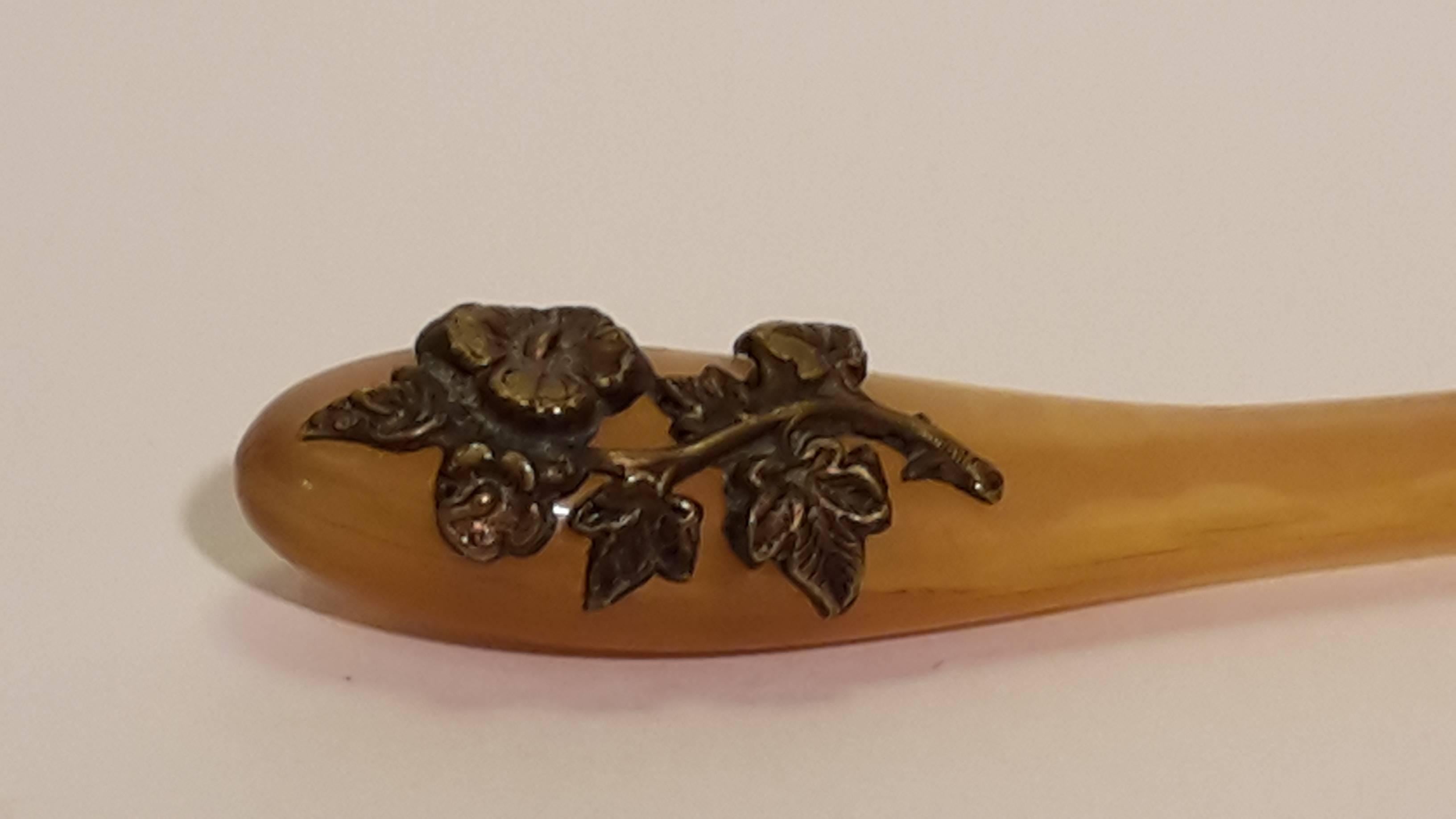 Contemporary Italian brass decoration feather, reminiscent of Art Nouveau. 
Beautiful color, unique item, collectible.