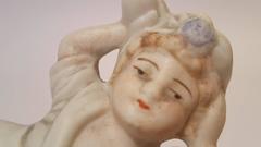 Small Porcelain Statue of a Reclining Woman