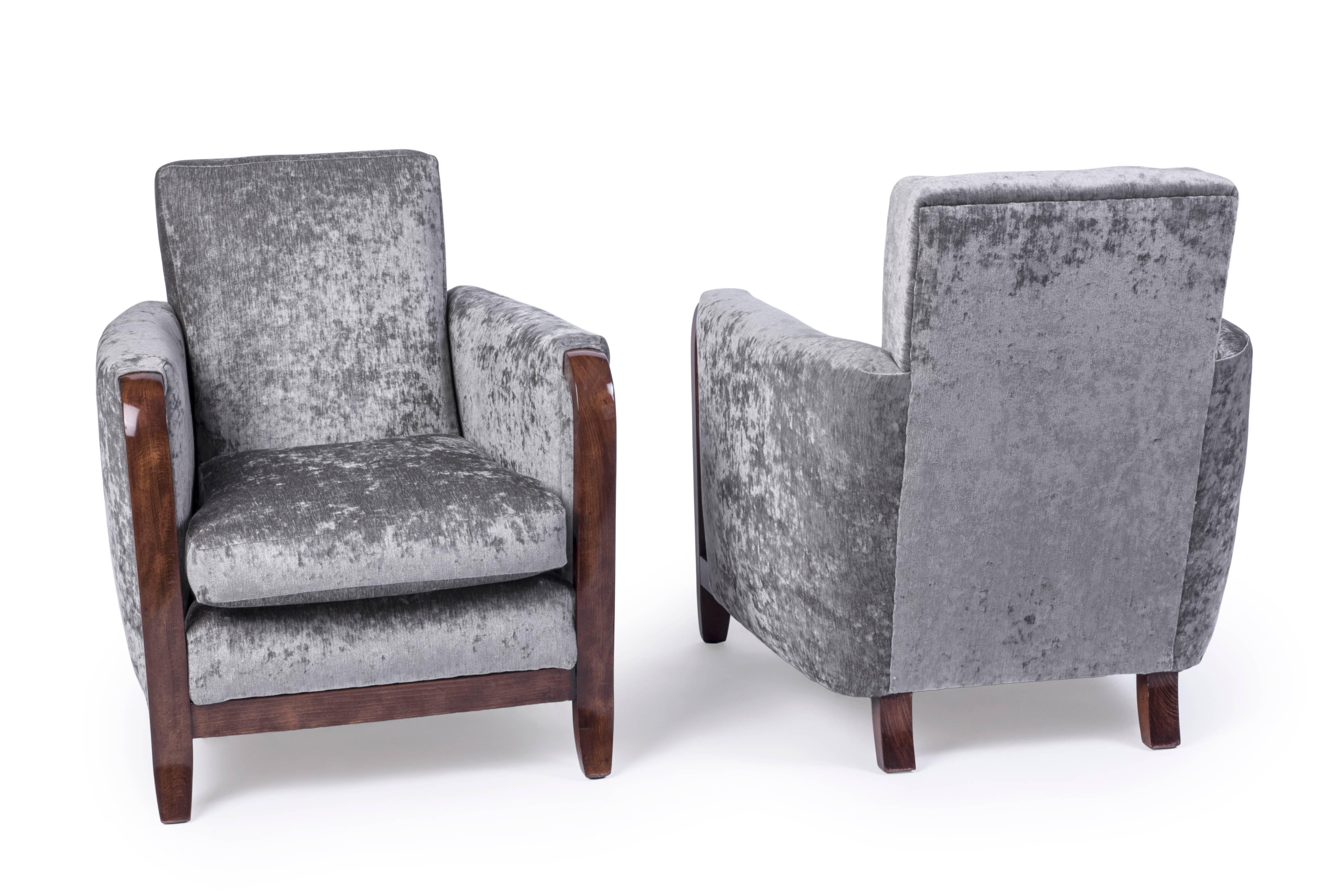 This exceptional pair of Jules Leleu Art Deco armchairs feature in solid mahogany frame and a luscious cotton or velvet fabric.