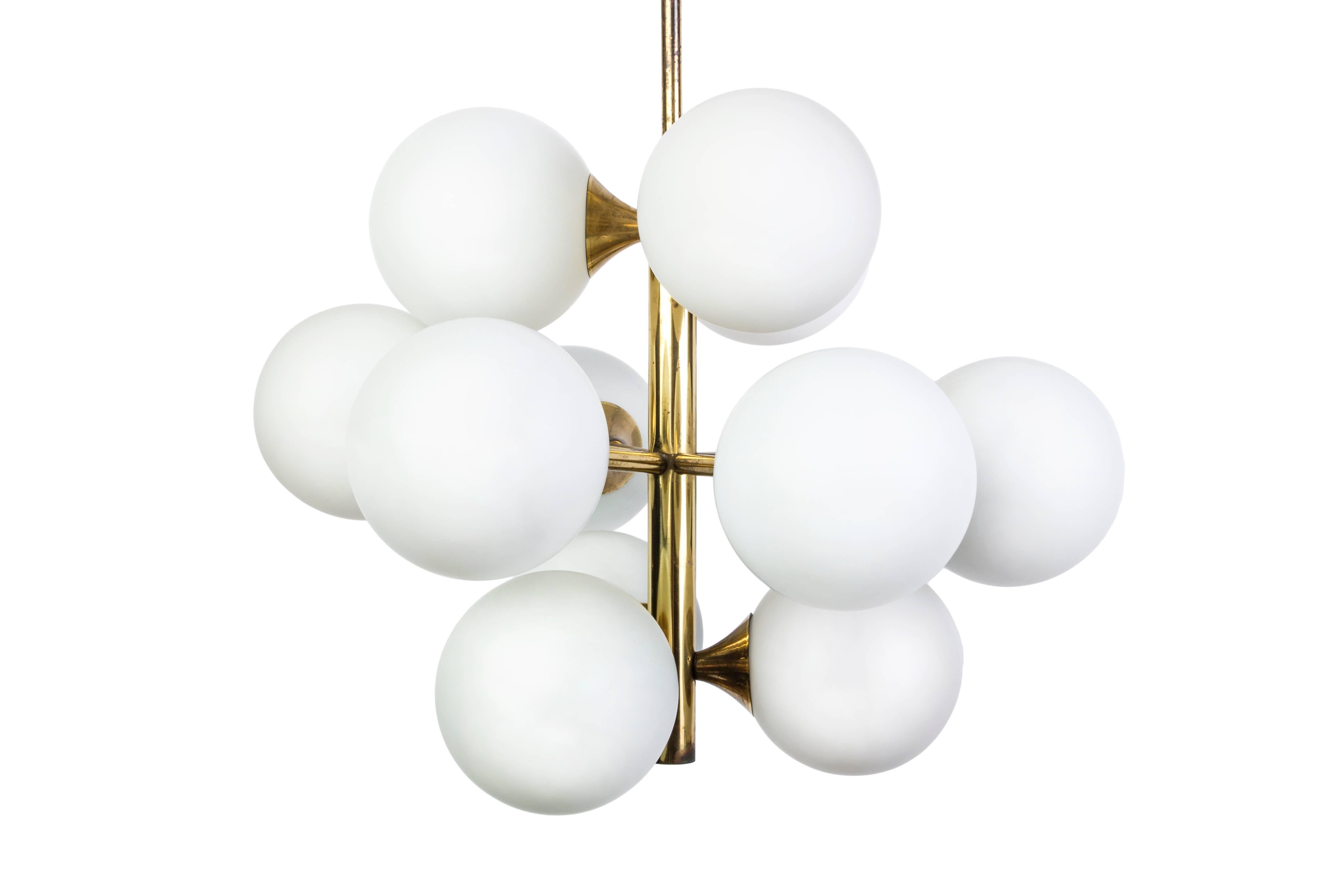 This wonderful Mid-Century Modernist Sputnik chandelier features a brass base with (12) opal glass bulbs. It is in excellent condition and has been newly rewired.

Made in Germany, circa 1960.