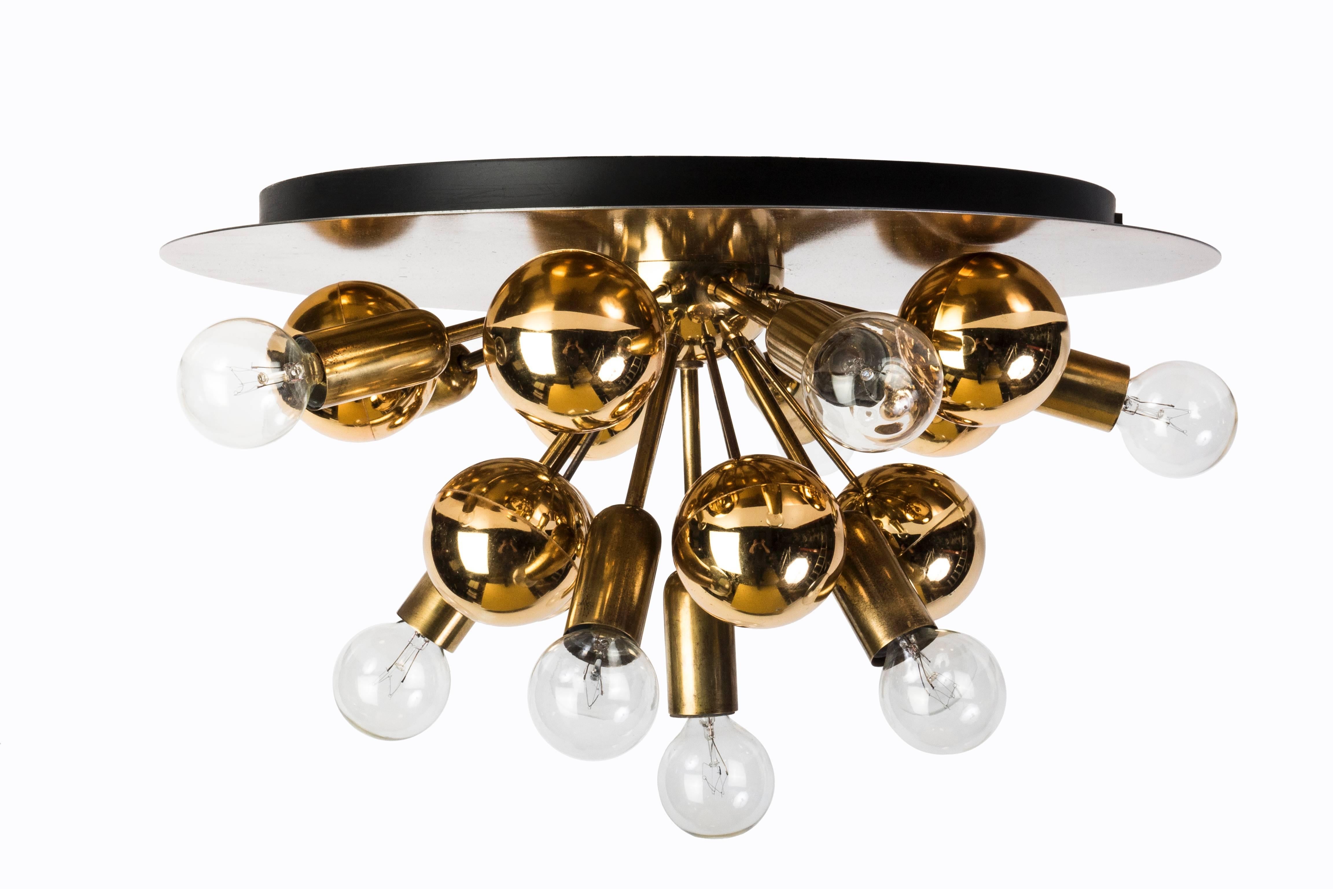 This exquisite Mid-Century Modern Sputnik flush mount or sconce features a brass frame with gold patina and gilt mirrored acrylic bulbs making these pieces absolute eyecatchers.