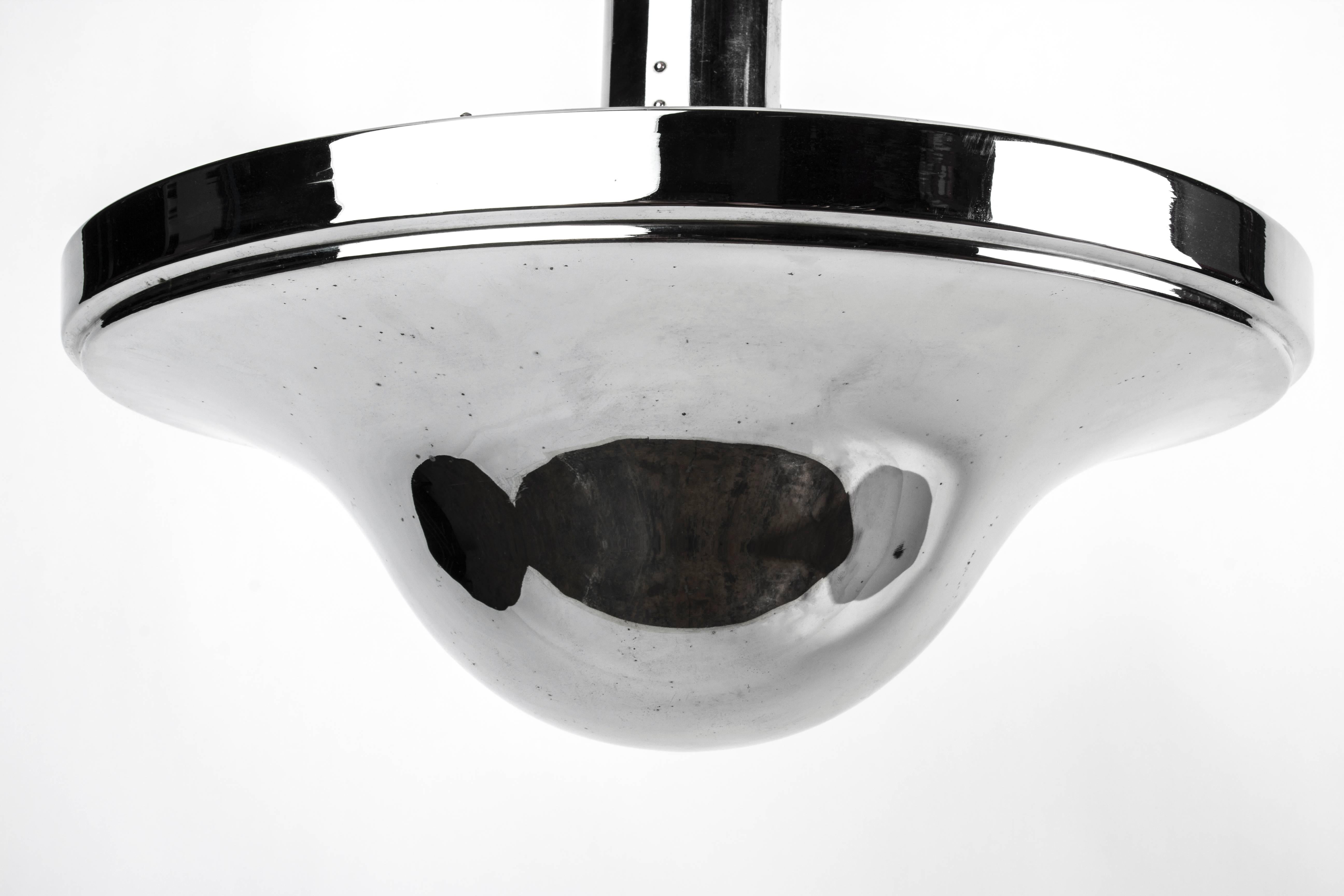 This extraordinary Bauhaus pendant features a mushroom shade in an original chrome finish.

Made in Germany          Circa 1950