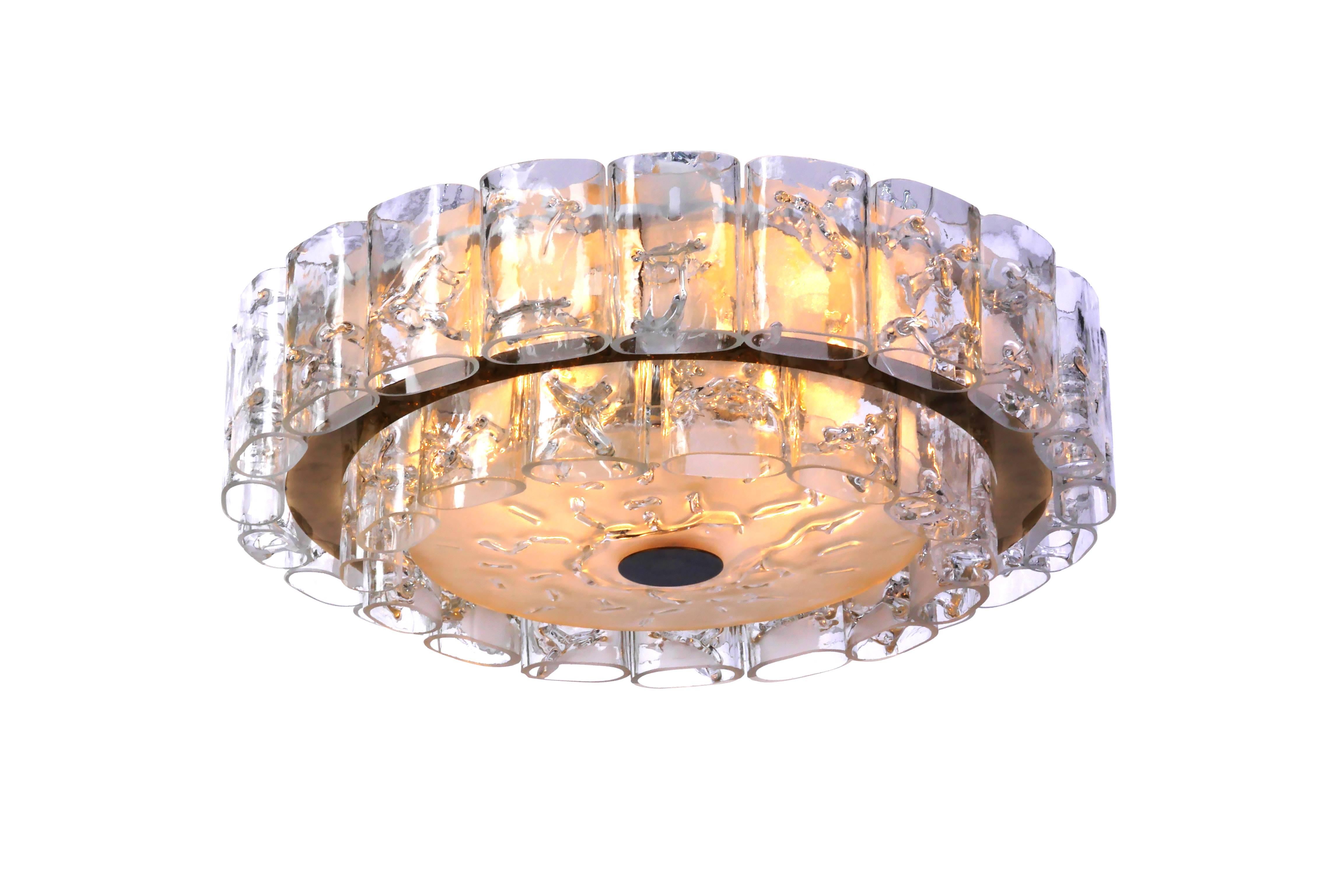 This exceptional 1960s Mid-Century Modernist flush mount was designed by Doria. It features a circular form with two-tiers of Murano glass tubes and brass detailing. It is in excellent condition and has been newly rewired.

Made in  Germany        