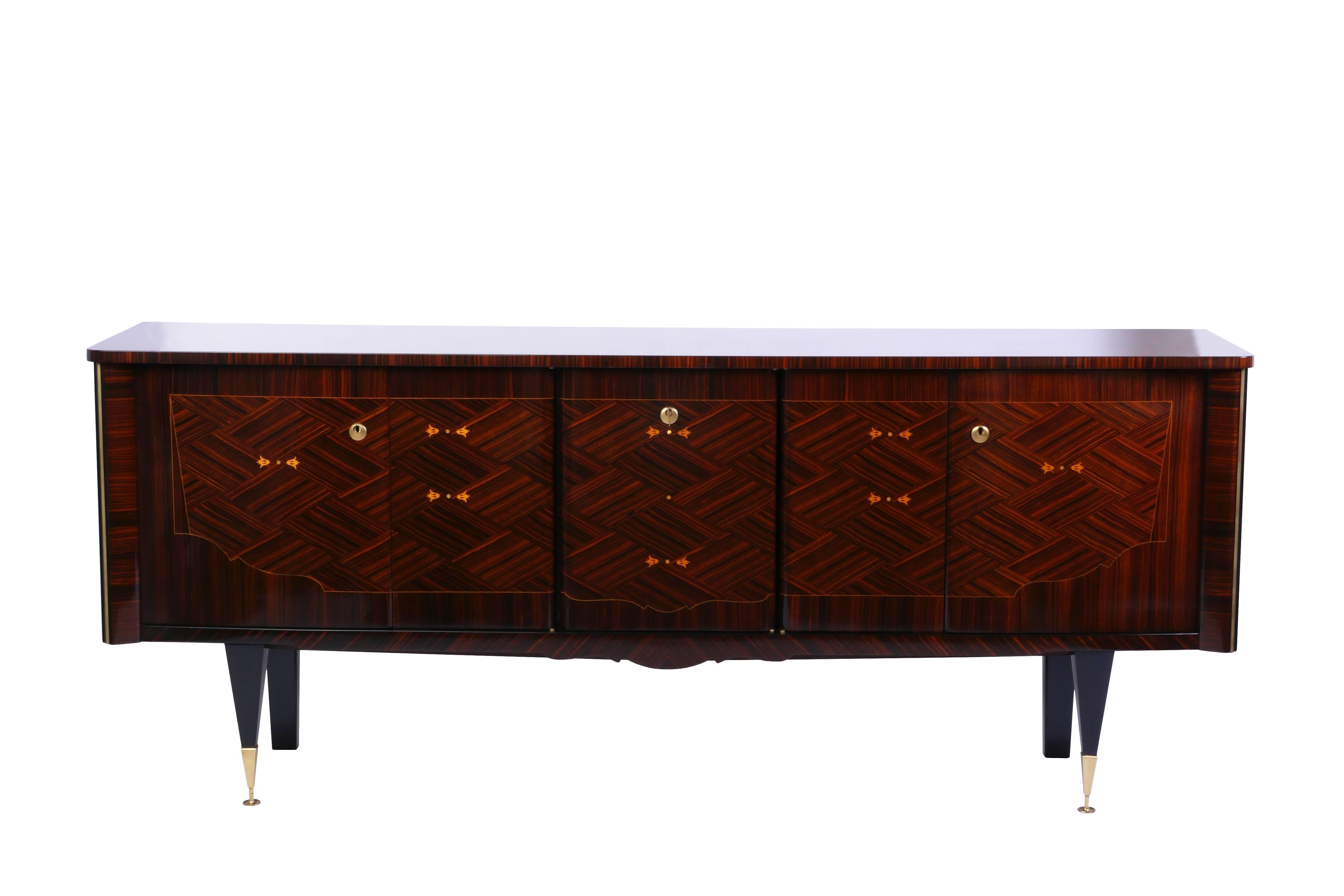 A French Art Deco buffet or sideboard in Macassar ebony with interior finished in Lemon-wood. Stunning marquetry and inlay work. Center bar area.