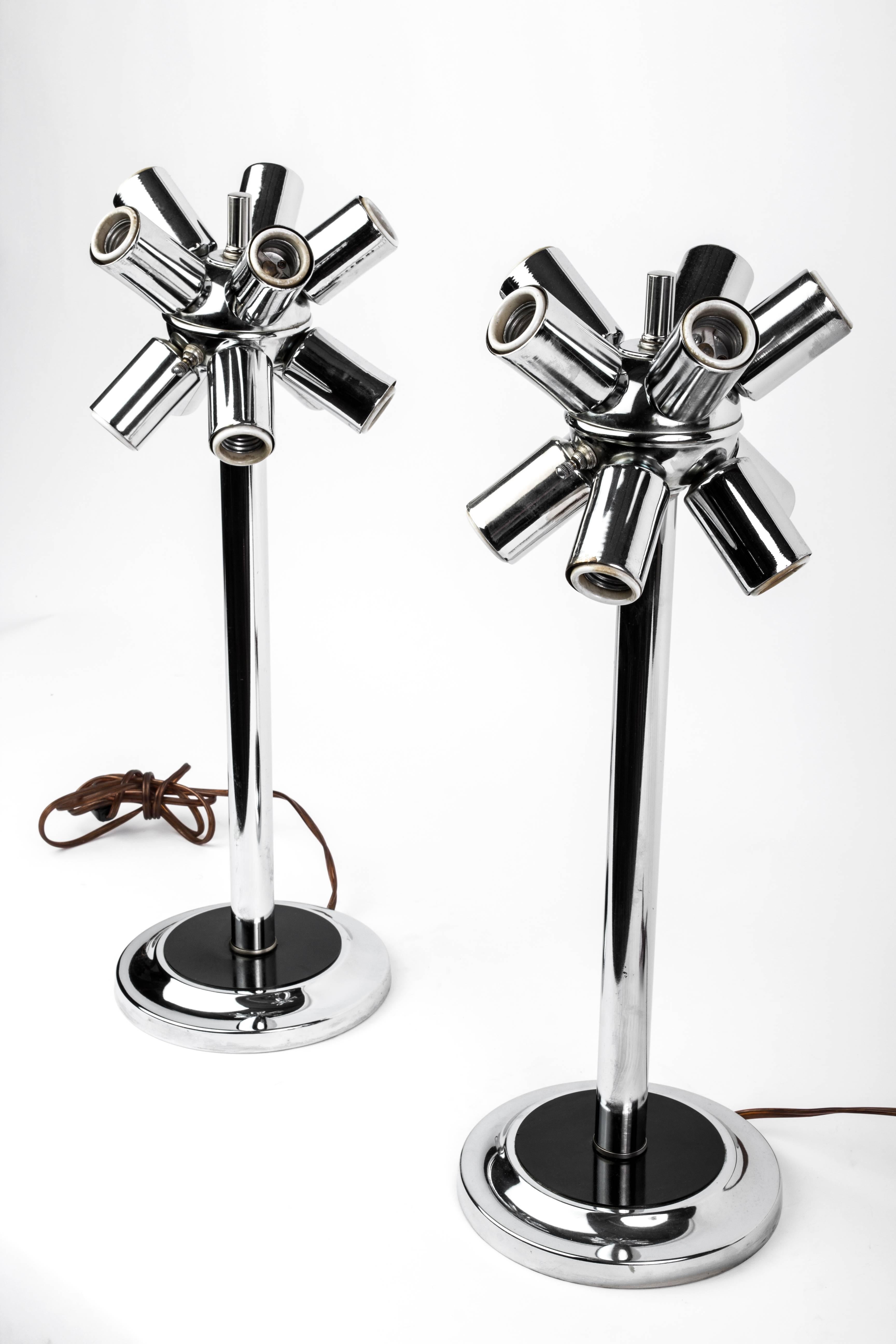 This superb pair of 1970s Mid-Century Modernist Sputnik table lamps feature an atomic form design on a chrome frame that holds (Ten) standard base globe bulbs each.

Made in Germany, circa 1970.