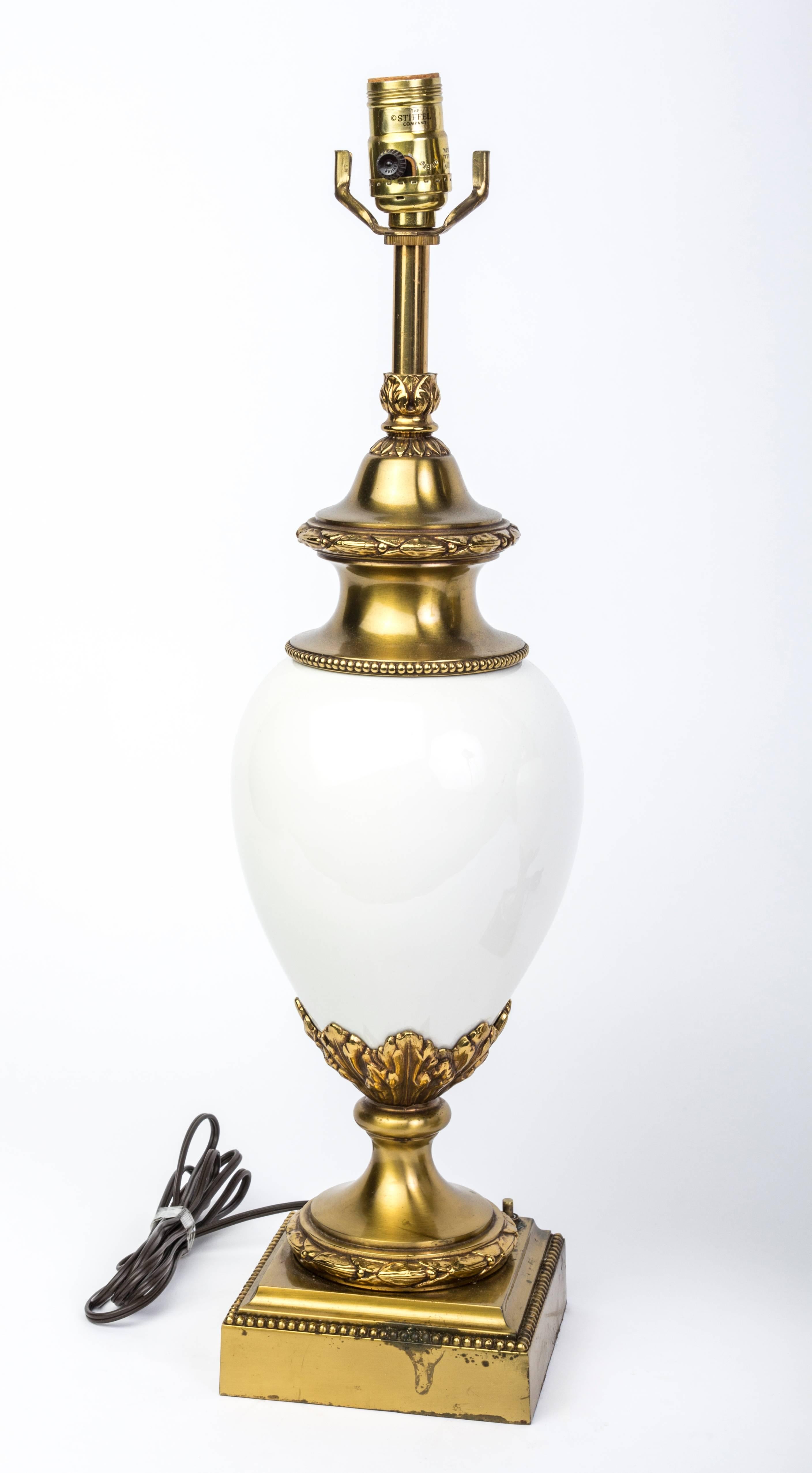 Pair of Hollywood Regency white ceramic and brass lamps by Stiffel.

Made in America, circa 1960.

  