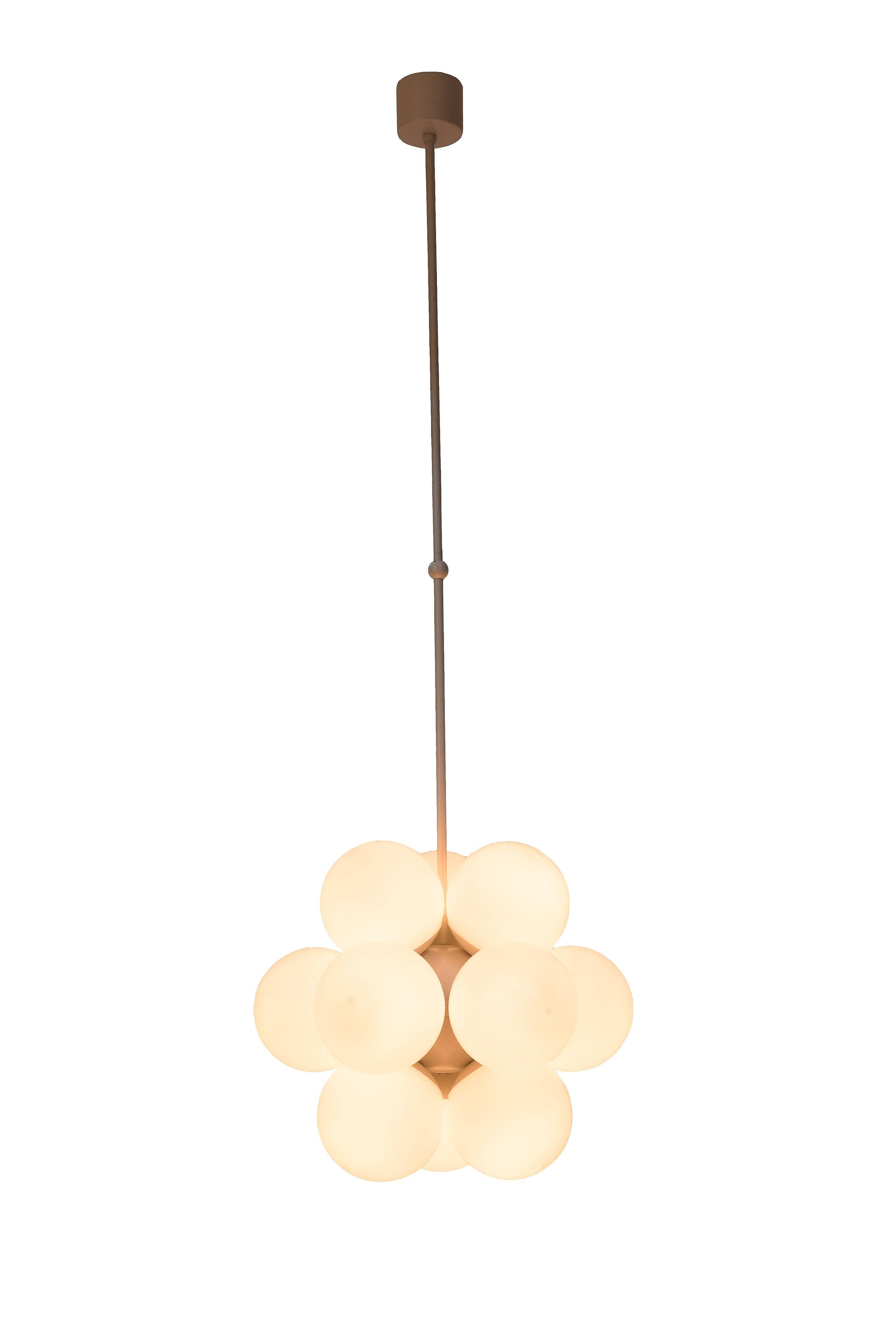 This gorgeous 1970s Mid-Century Modernist chandelier was designed by Kaiser Leuchten and it features and enameled brass frame and 12 handblown double layer opal glass globes.

Made in Germany, circa 1970

Measures: 15