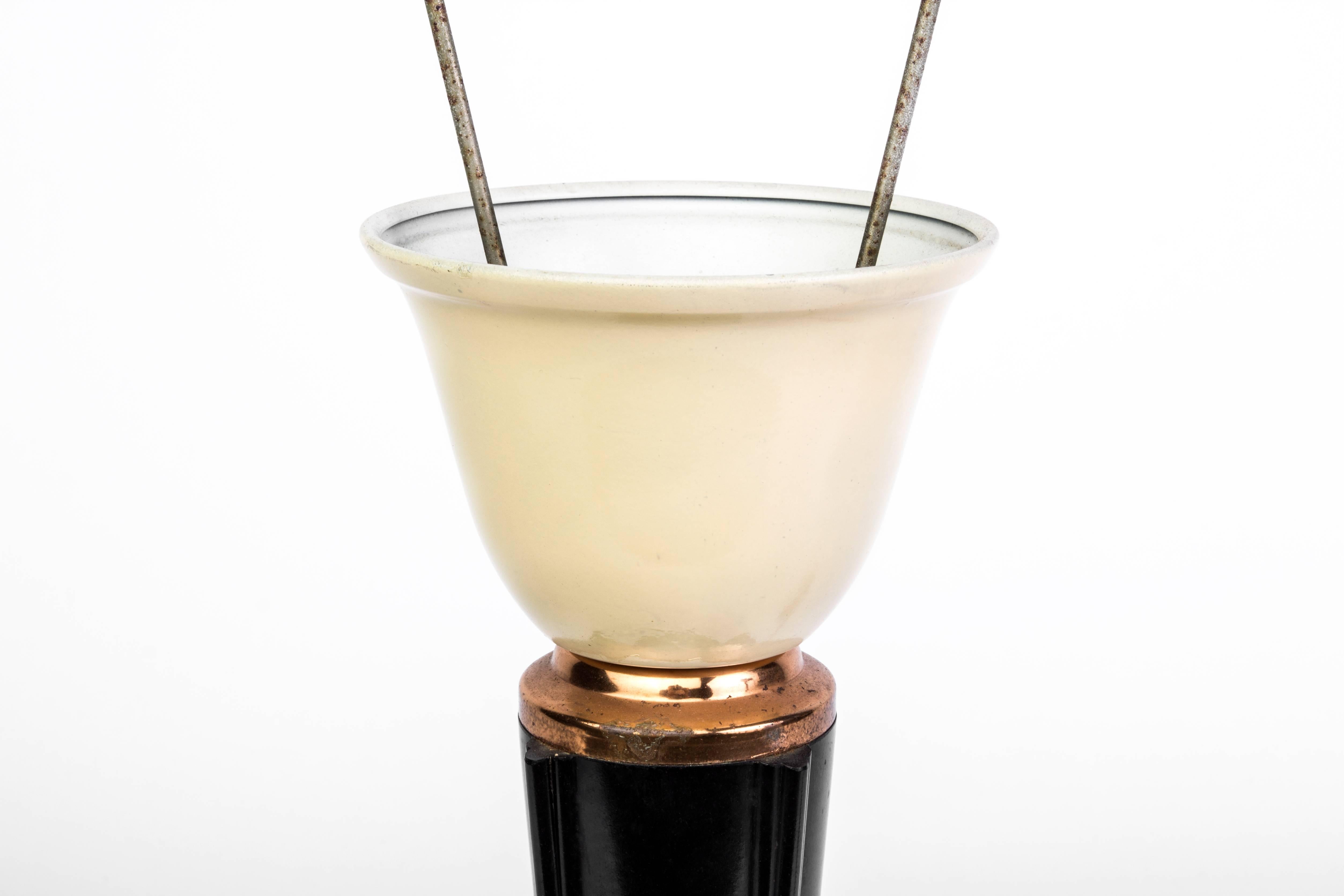 This wonderful Art Deco lame was designed by Jumo. It features a mushroom form design with a bakelite shade, brass detailing and a high gloss black lacquer finish. It is in excellent condition and has been newly rewired.

Made in France, circa