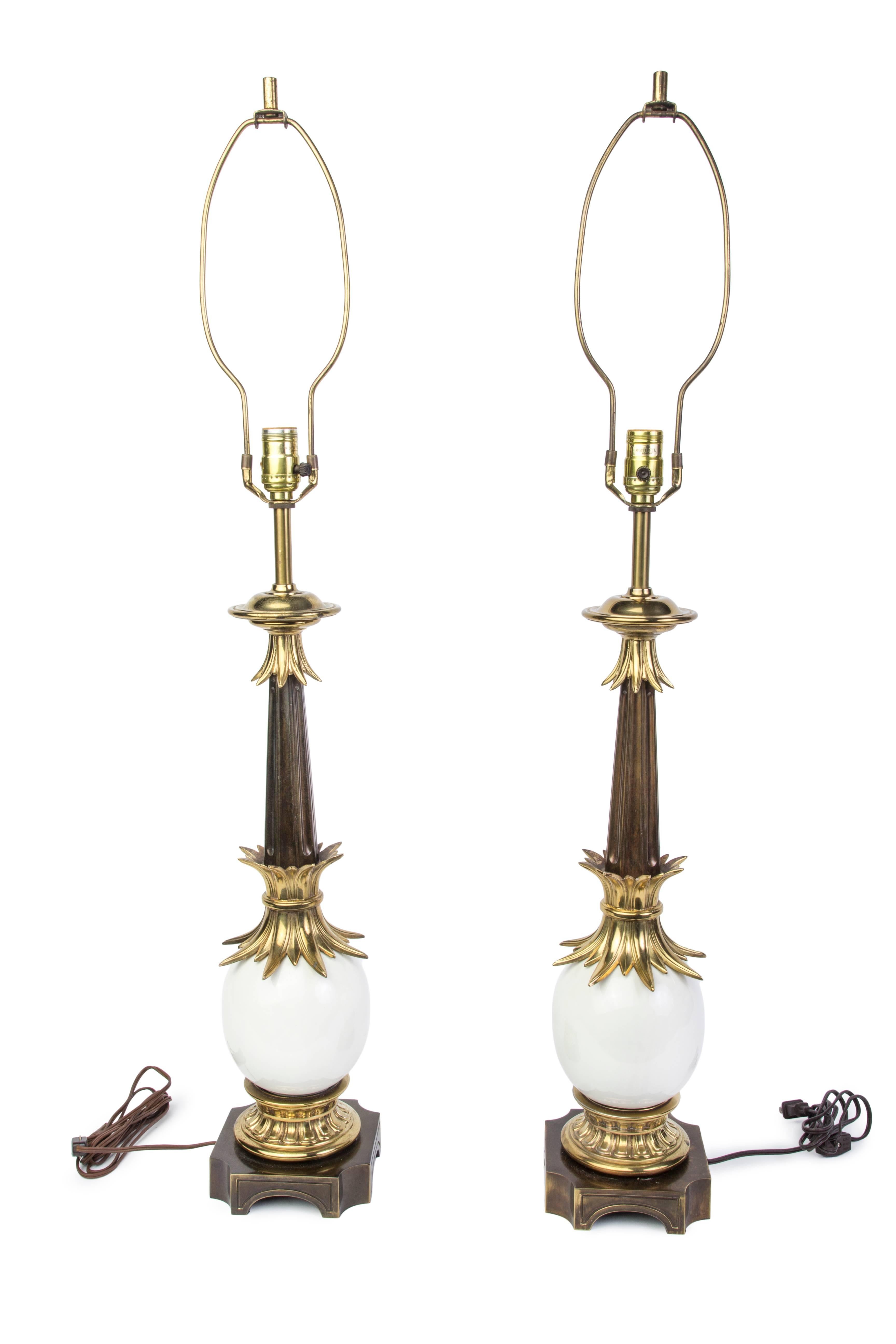 Pair of Hollywood Regency brass and ostrich eggshell lamps by Stiffel.

Made in America, circa 1960

Measures: 39