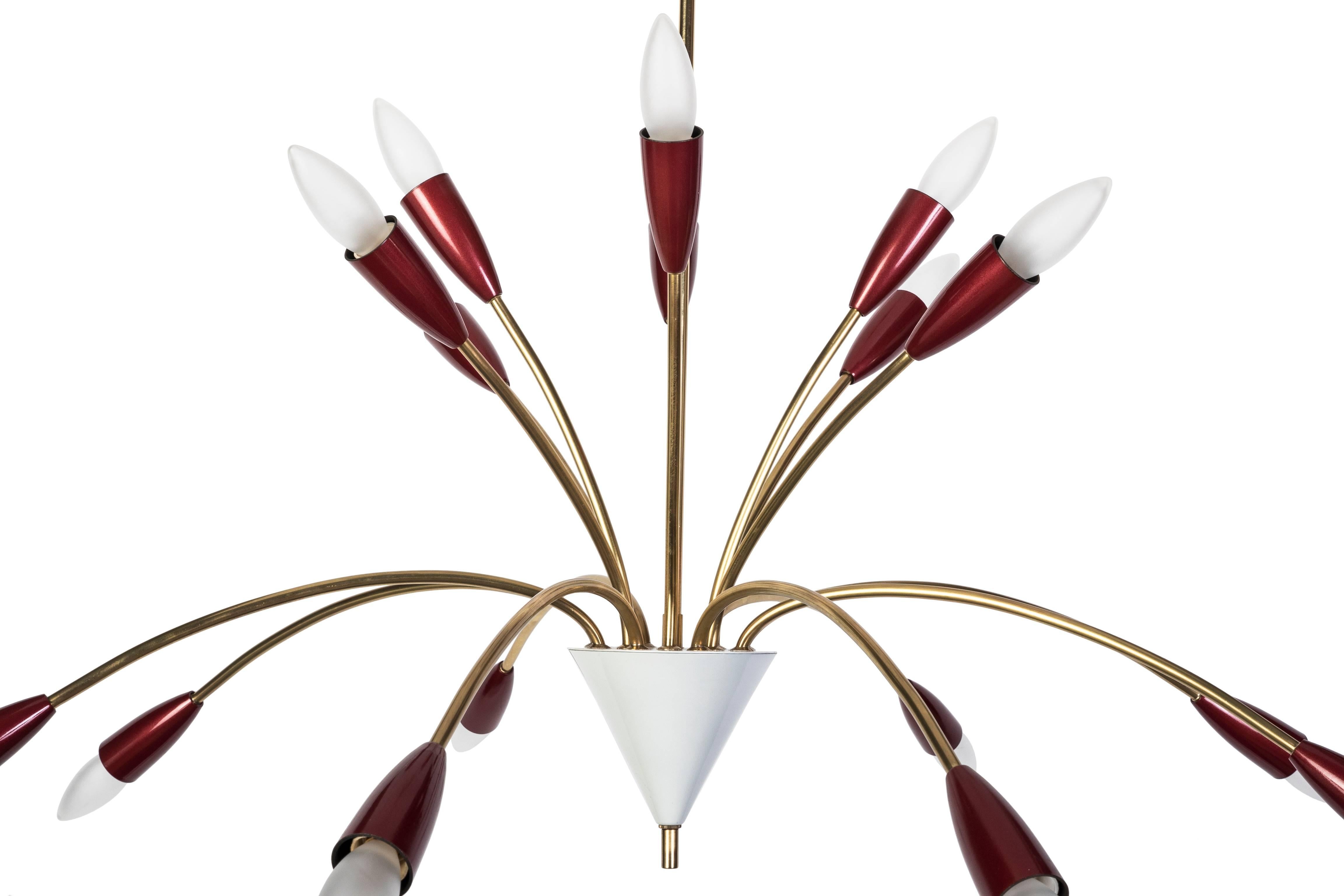 This beautiful 1950s spider Sputnik chandelier in the style of Stilnovo and it features a brass frame with (16) conical Bordeaux color shades protruding from the base.

Made in Germany, circa 1950.