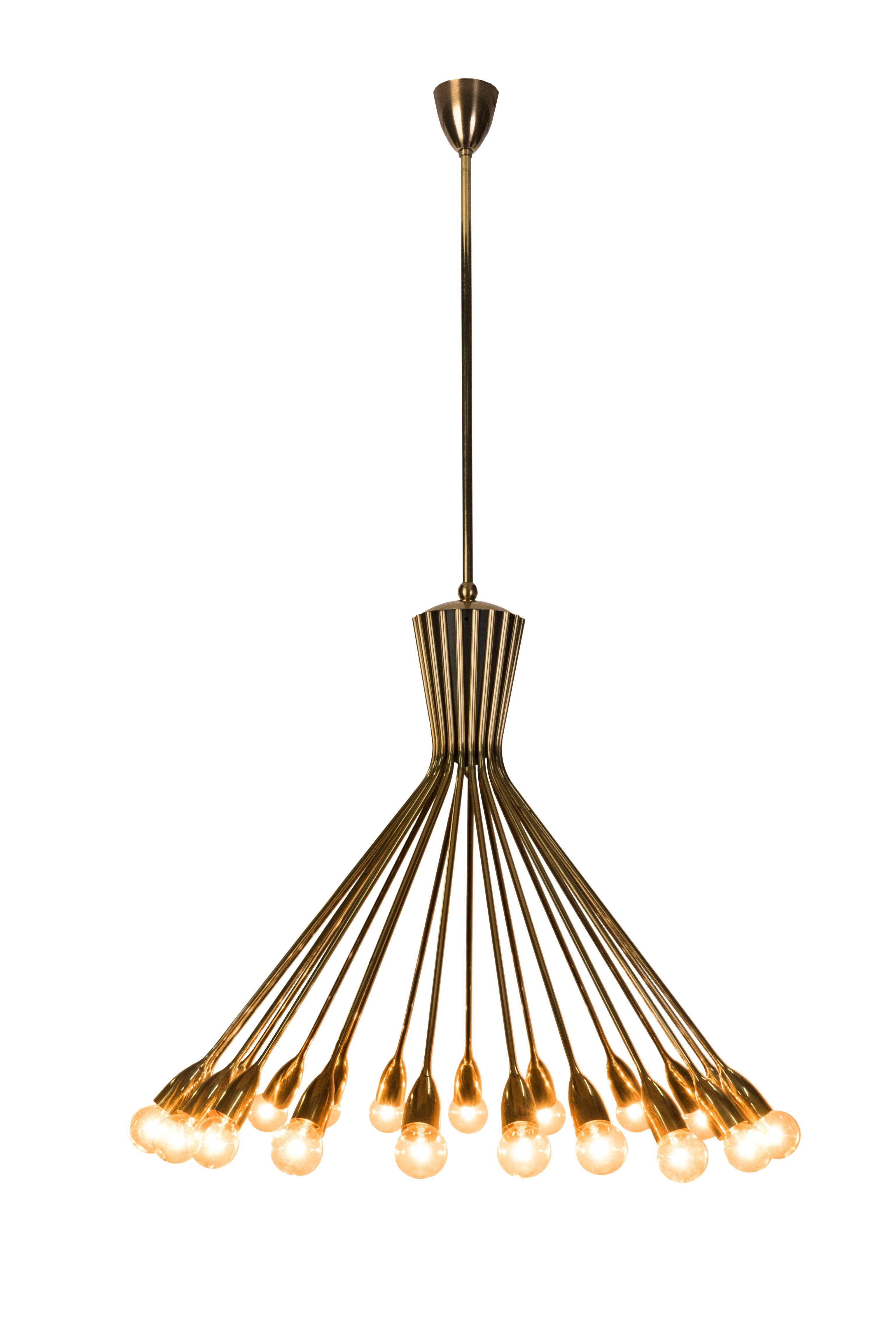 This Mid-Century Modernist spider Sputnik chandelier in the style of Stilnovo and it features a 20 arms polished brass frame. The chandelier is in excellent original condition.

Made in Germany, circa 1950.
       